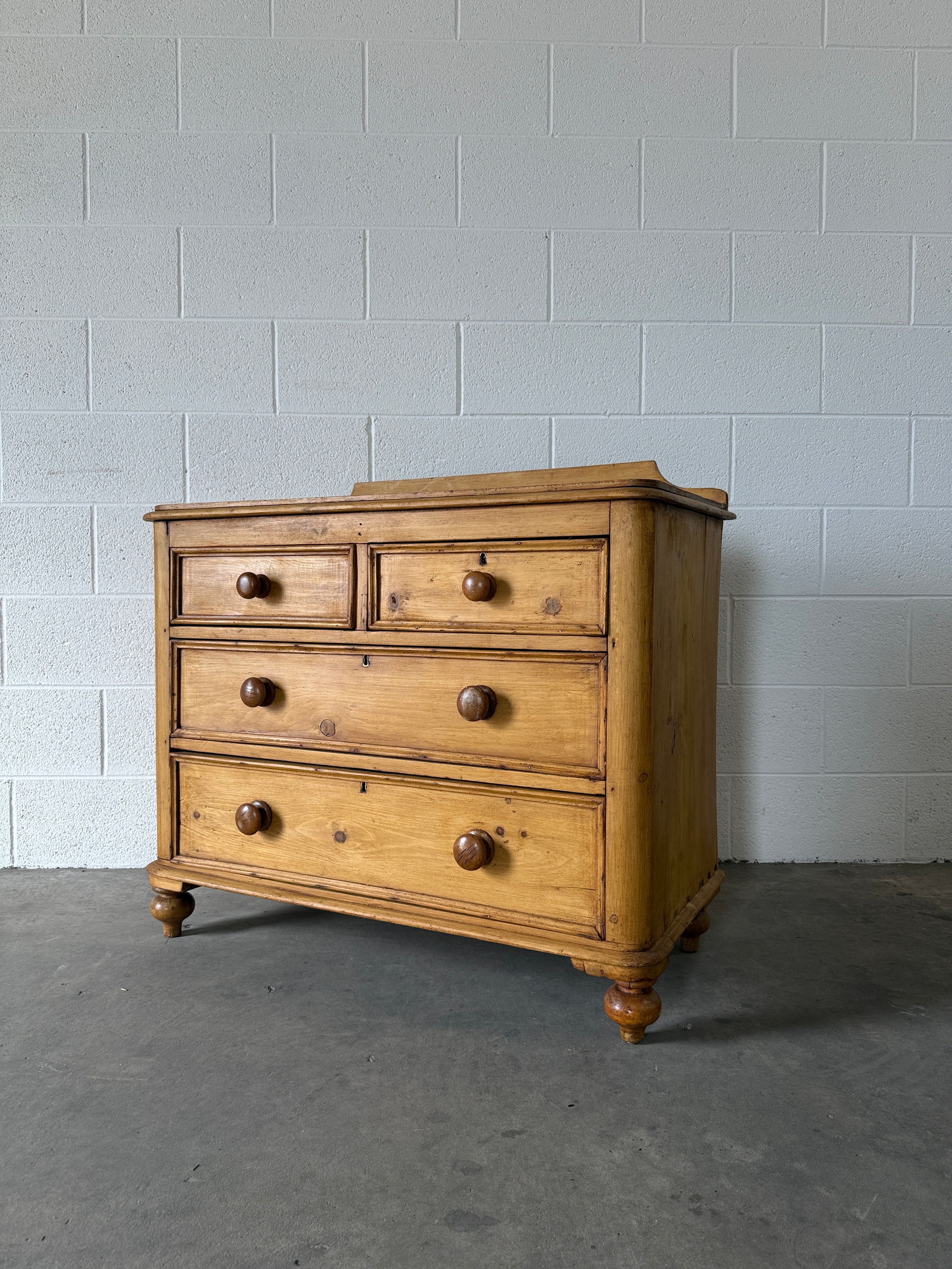 Small antique pine chest of drawers with gallery back