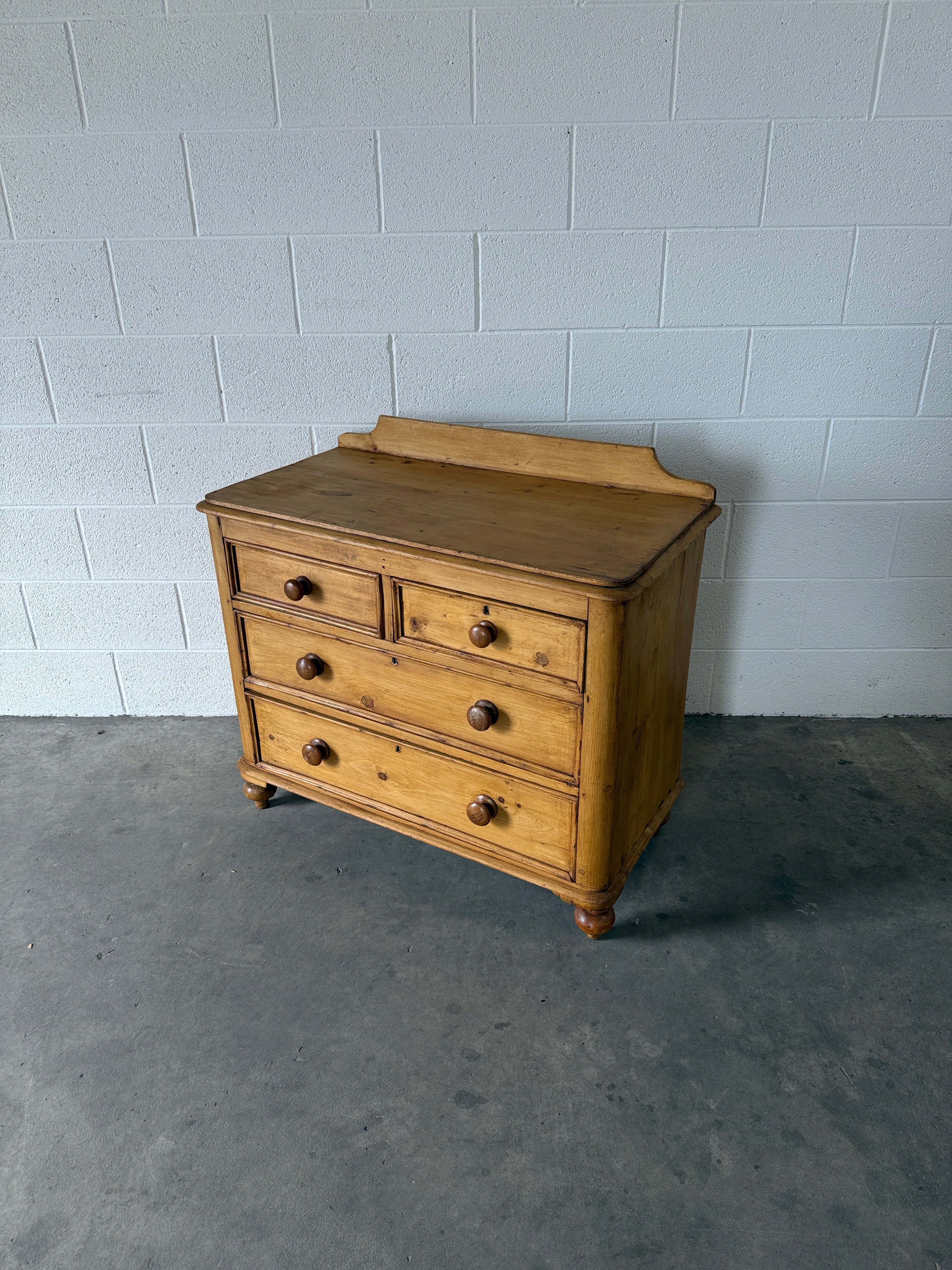 Small antique pine chest of drawers with gallery back