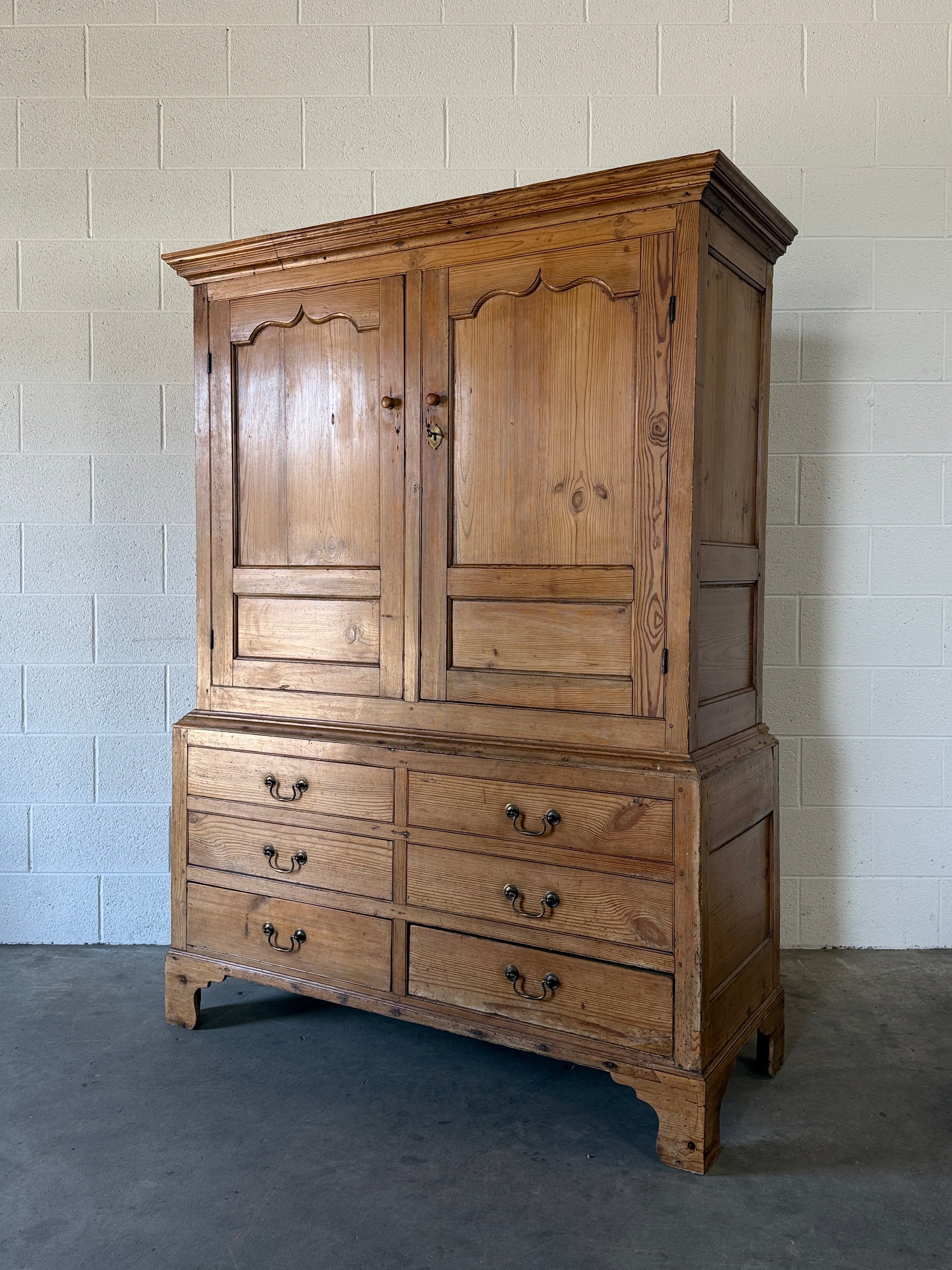Antique English pine wardrobe with lower drawers