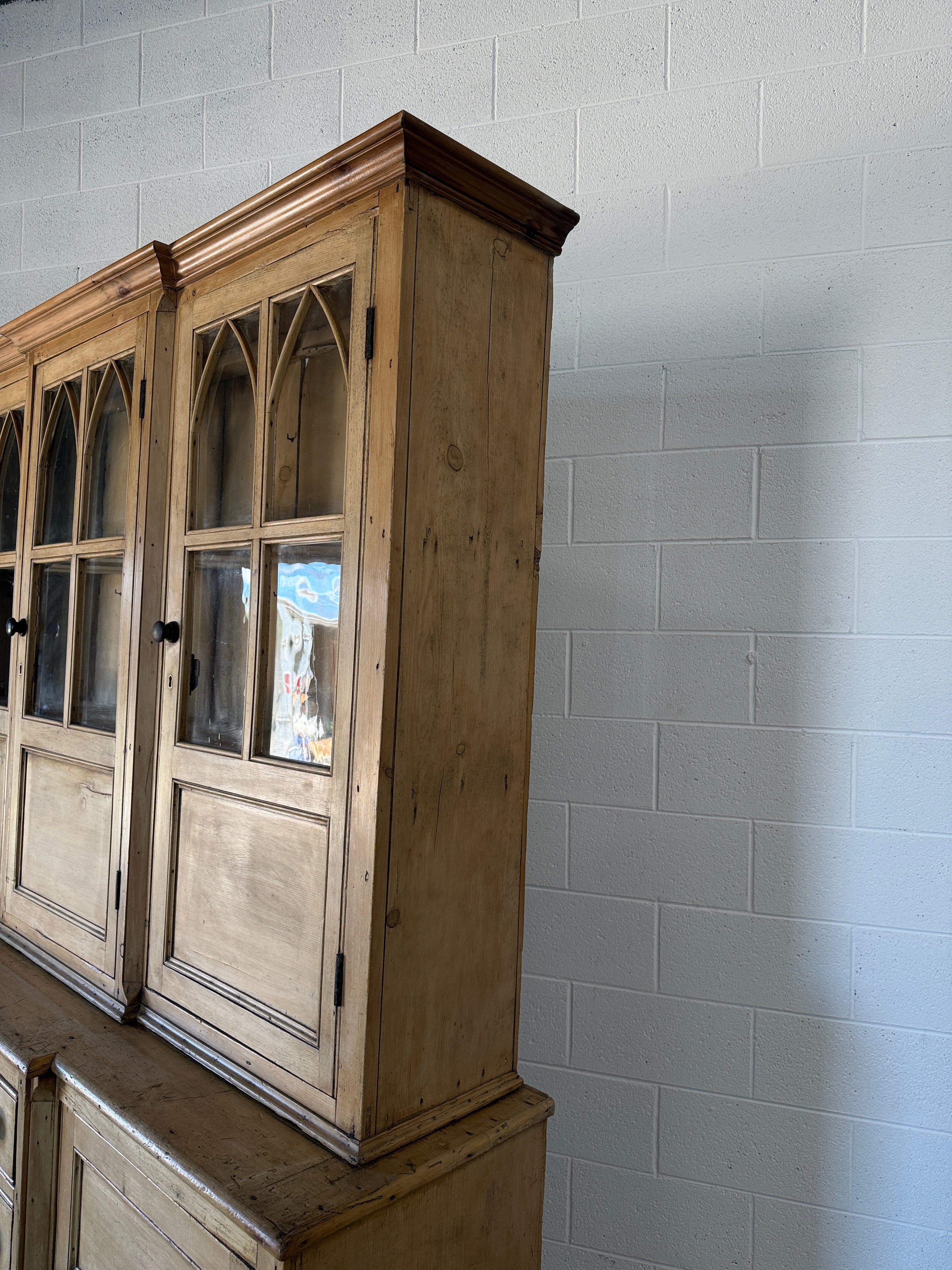 19th‑century English pine cupboard or display case with glass doors