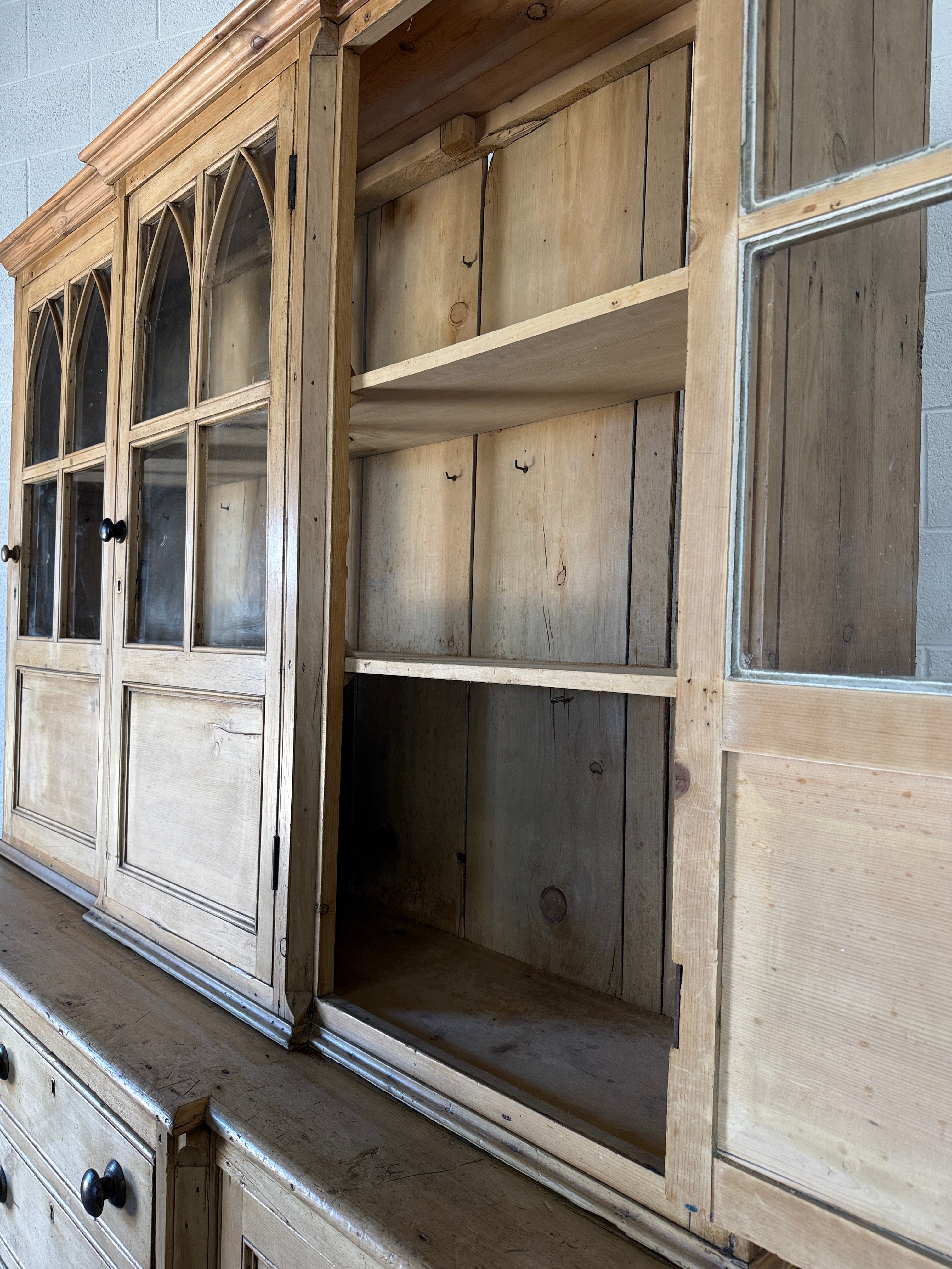 19th‑century English pine cupboard or display case with glass doors