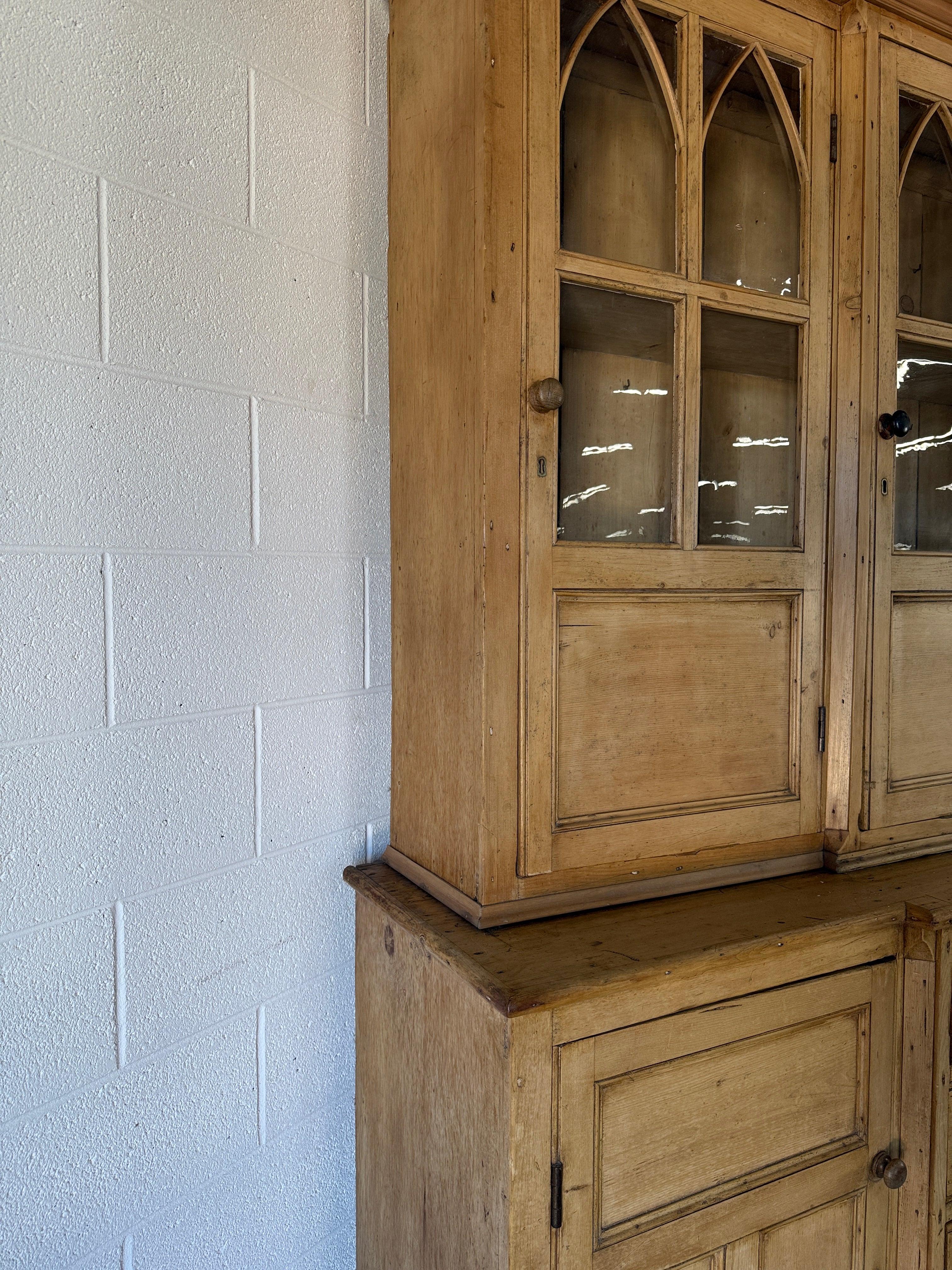 19th‑century English pine cupboard or display case with glass doors
