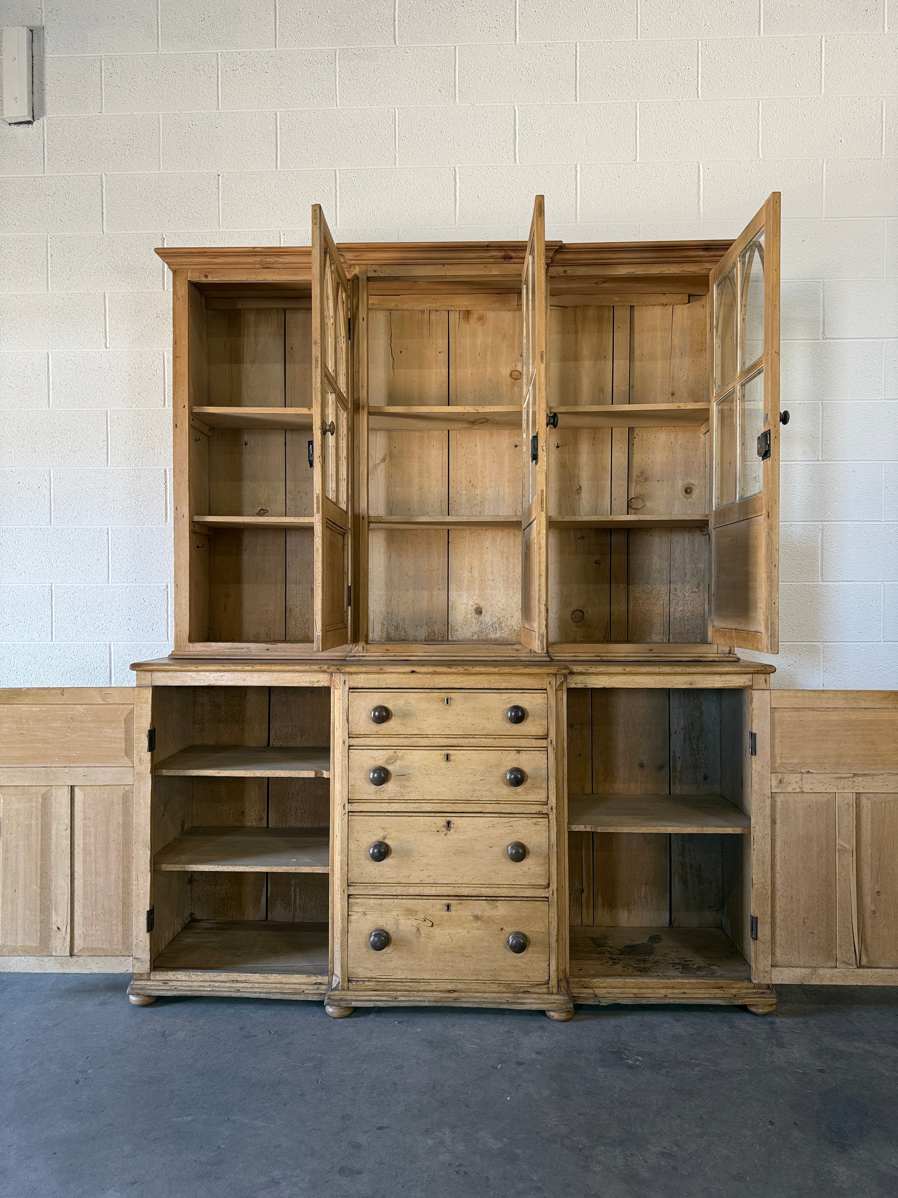 19th‑century English pine cupboard or display case with glass doors