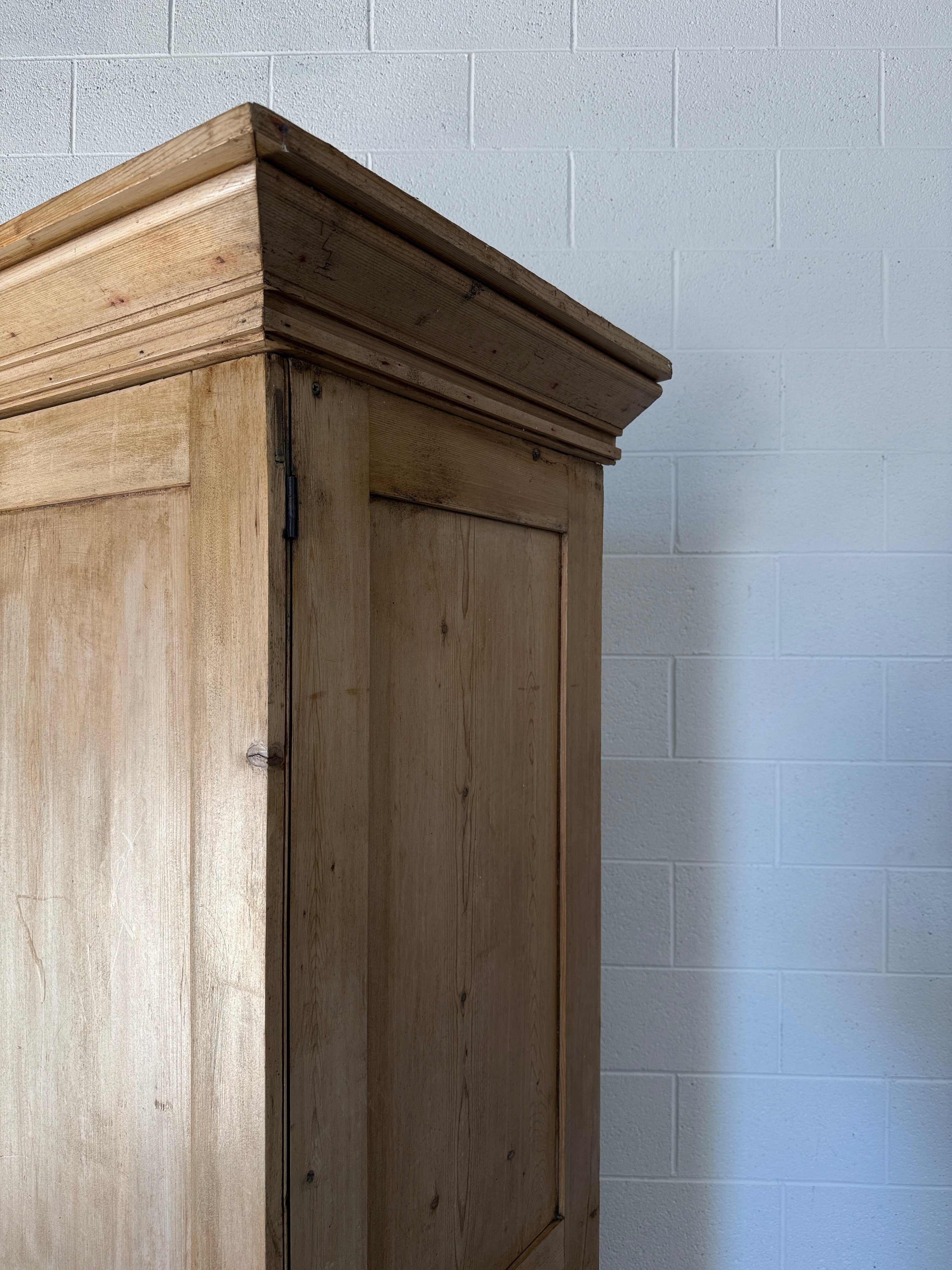 Early–mid 19th‑century English pine wardrobe with base drawer