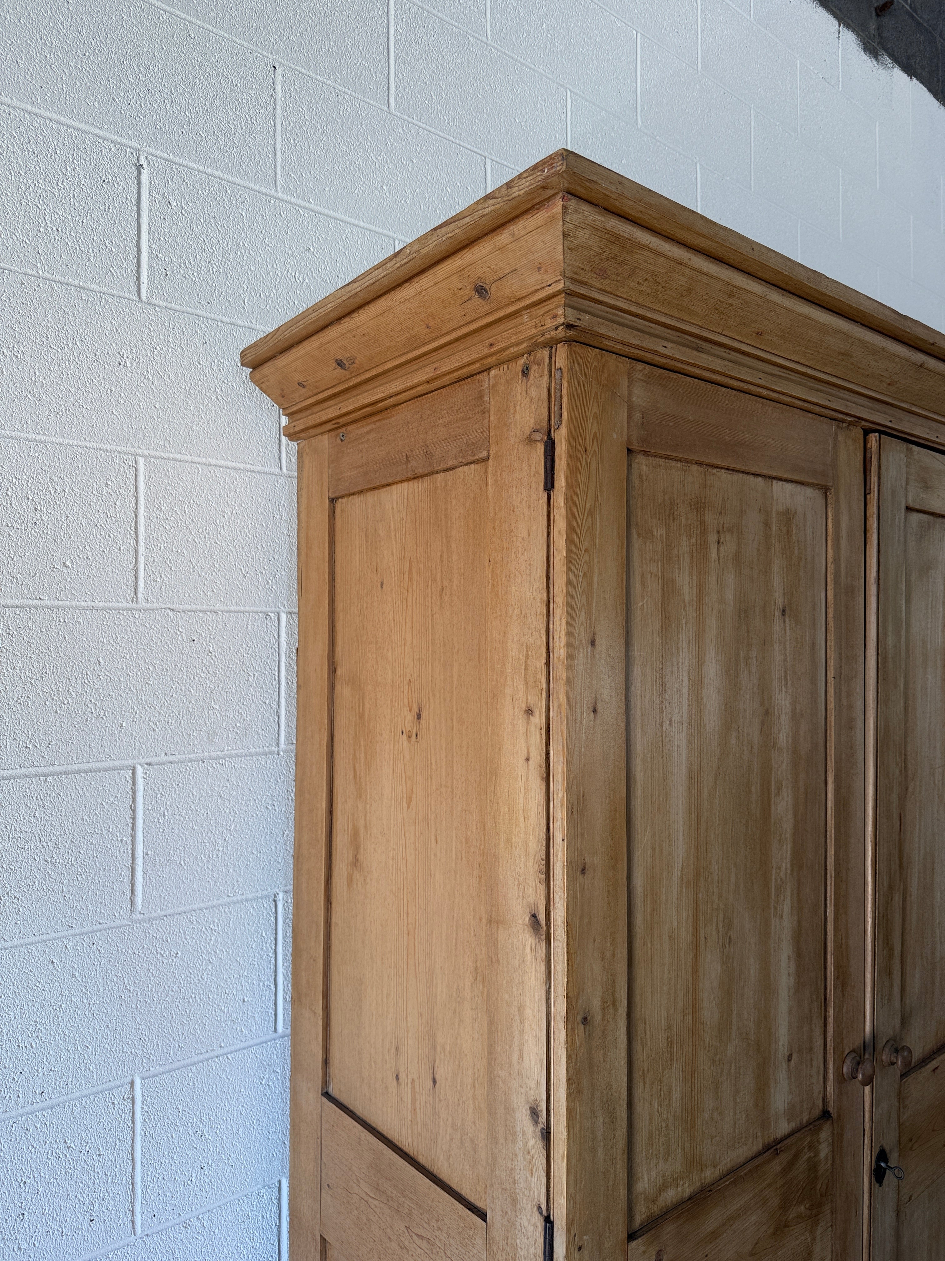 Early–mid 19th‑century English pine wardrobe with base drawer