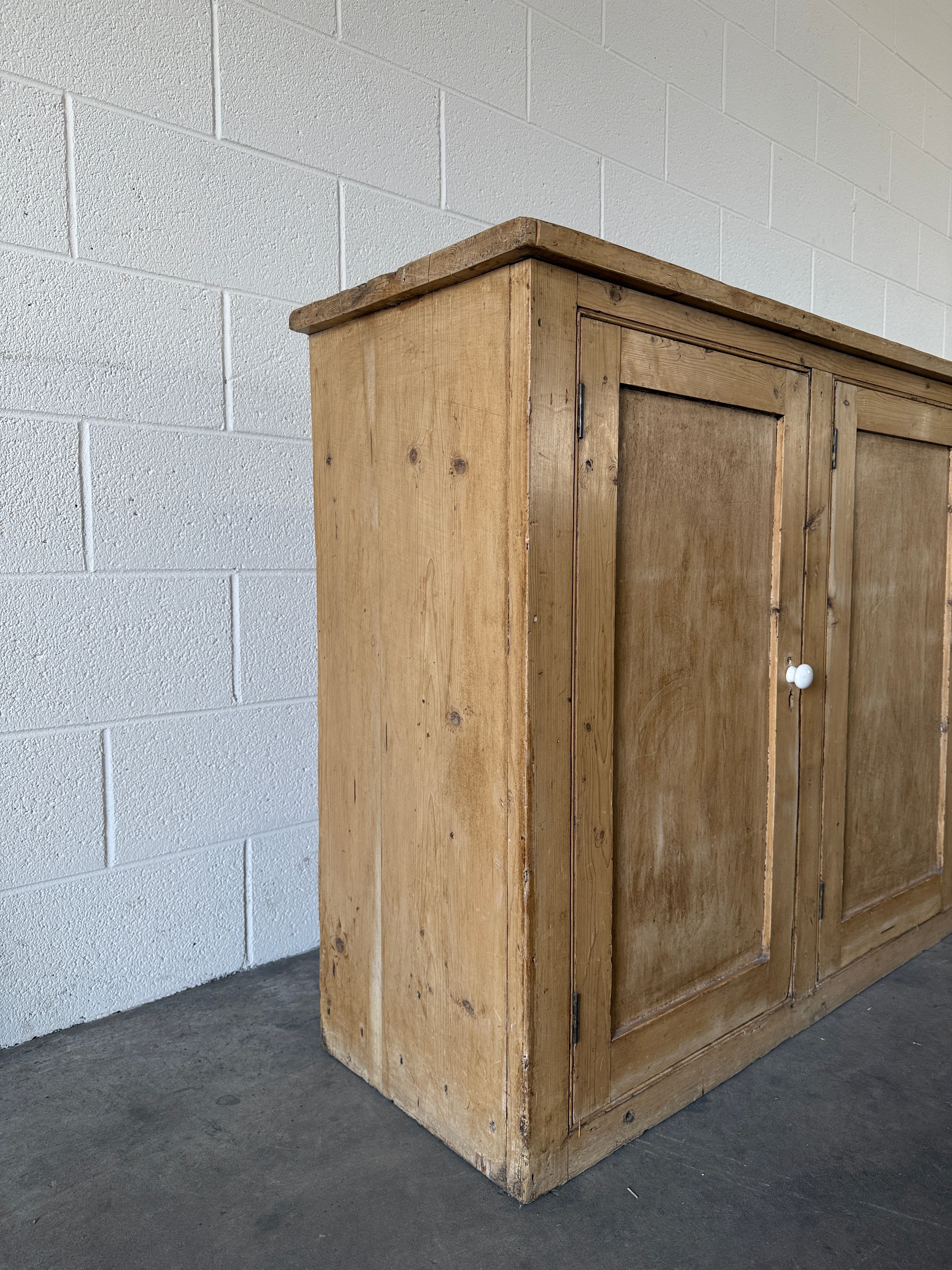 Simple antique pine sideboard with four doors