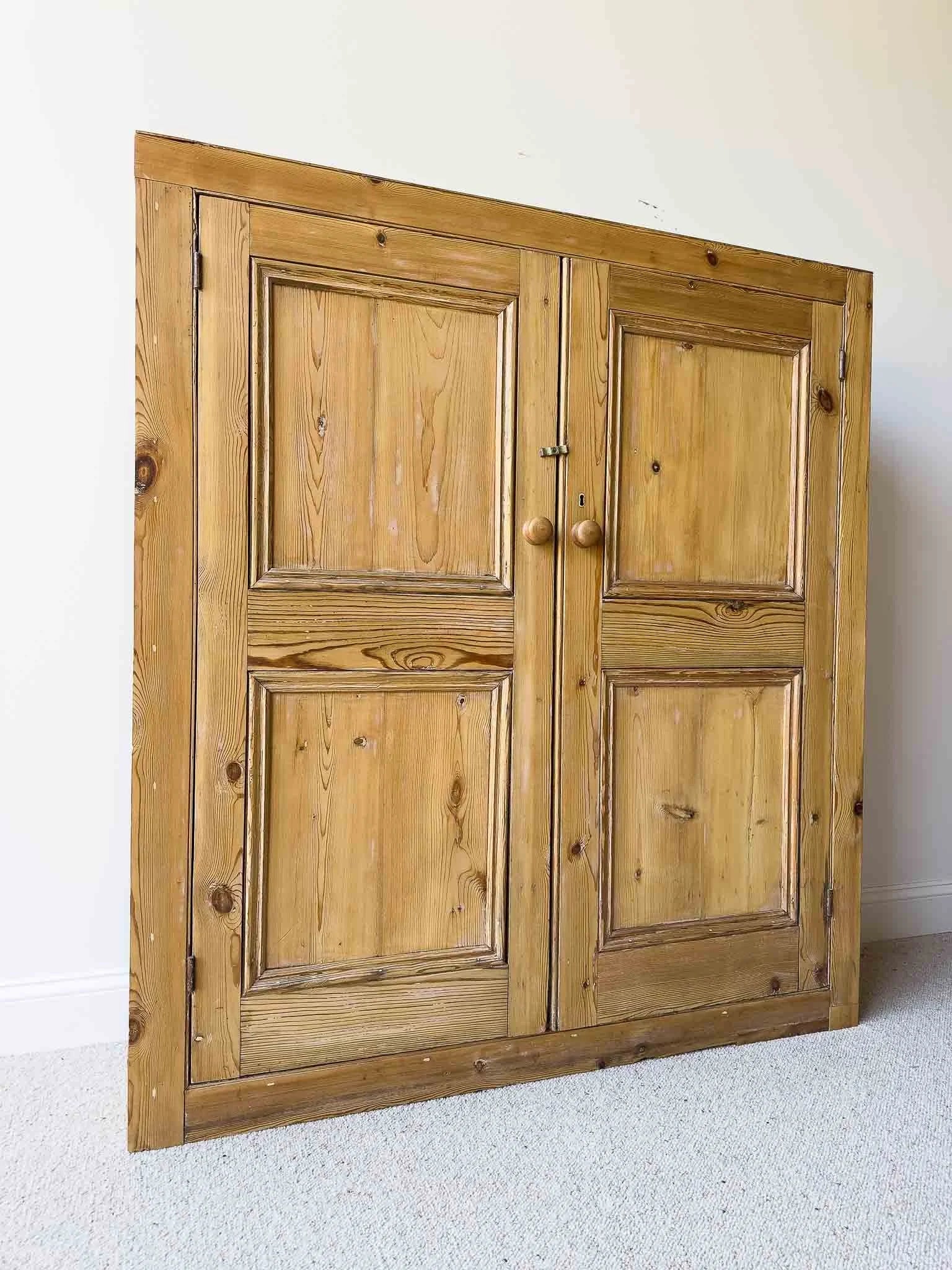A large antique pine cupboard