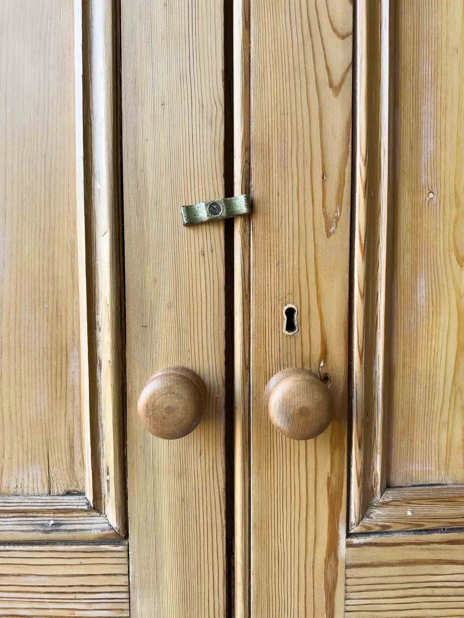A large antique pine cupboard