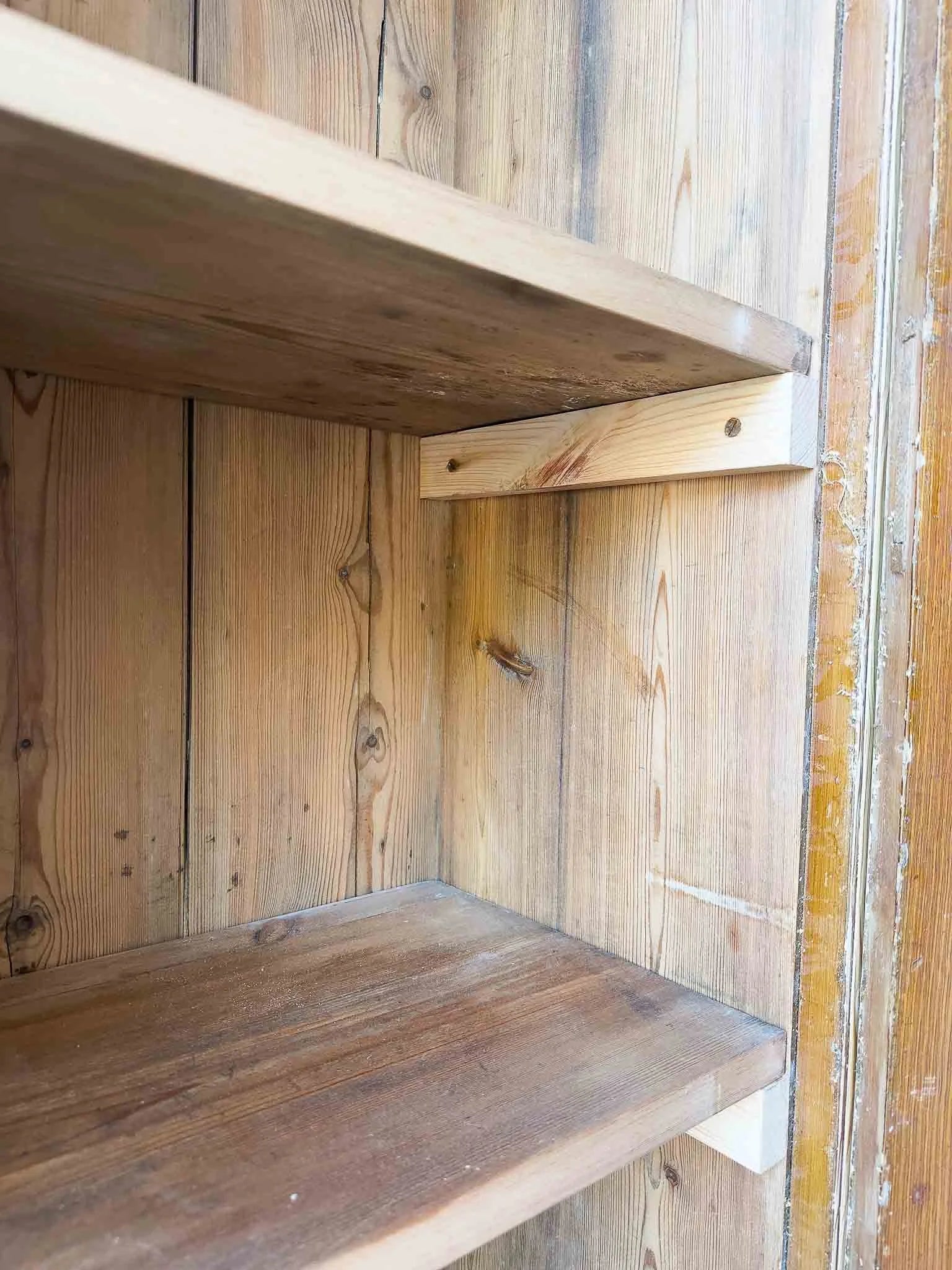 A large antique pine cupboard