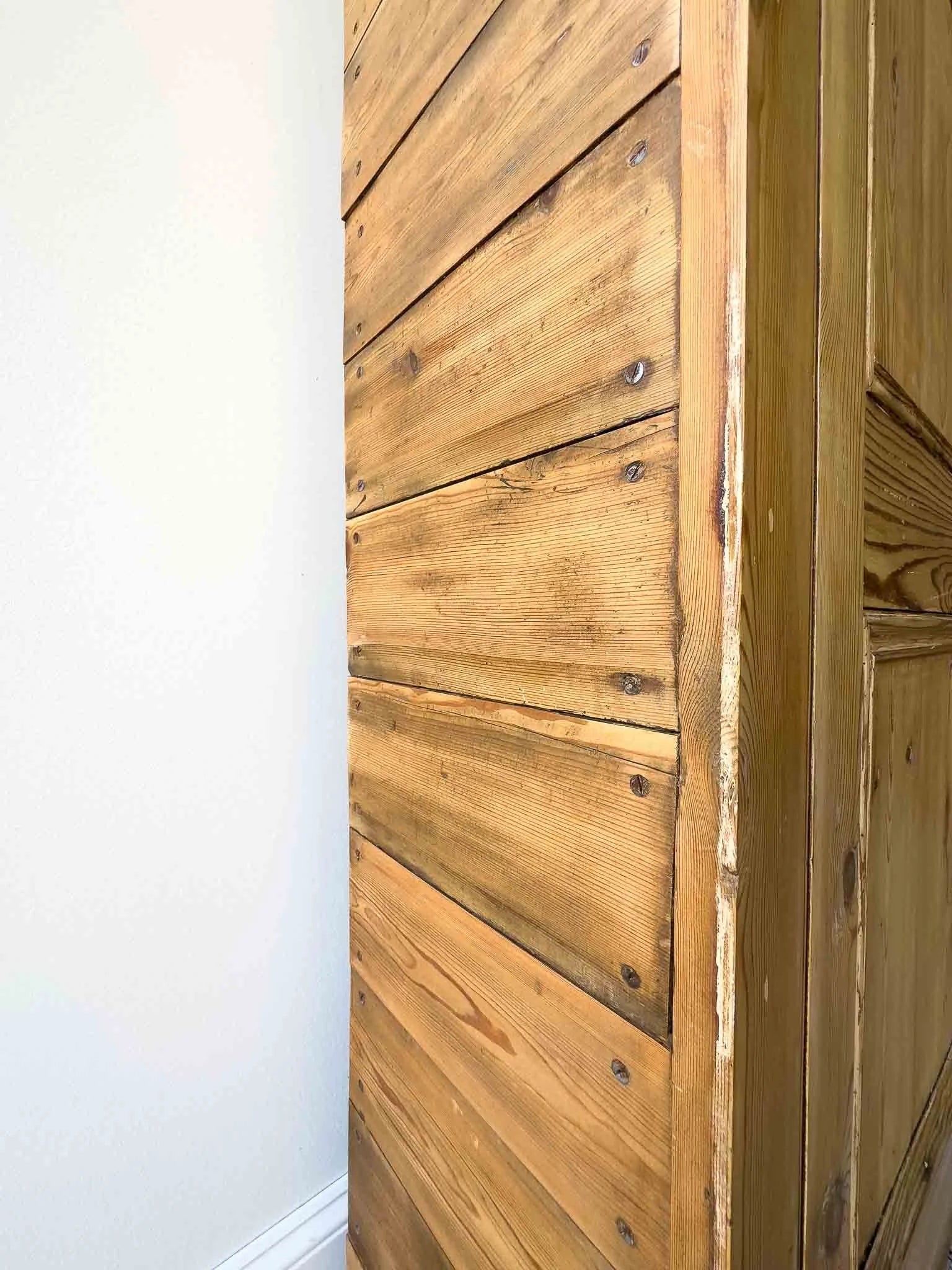 A large antique pine cupboard