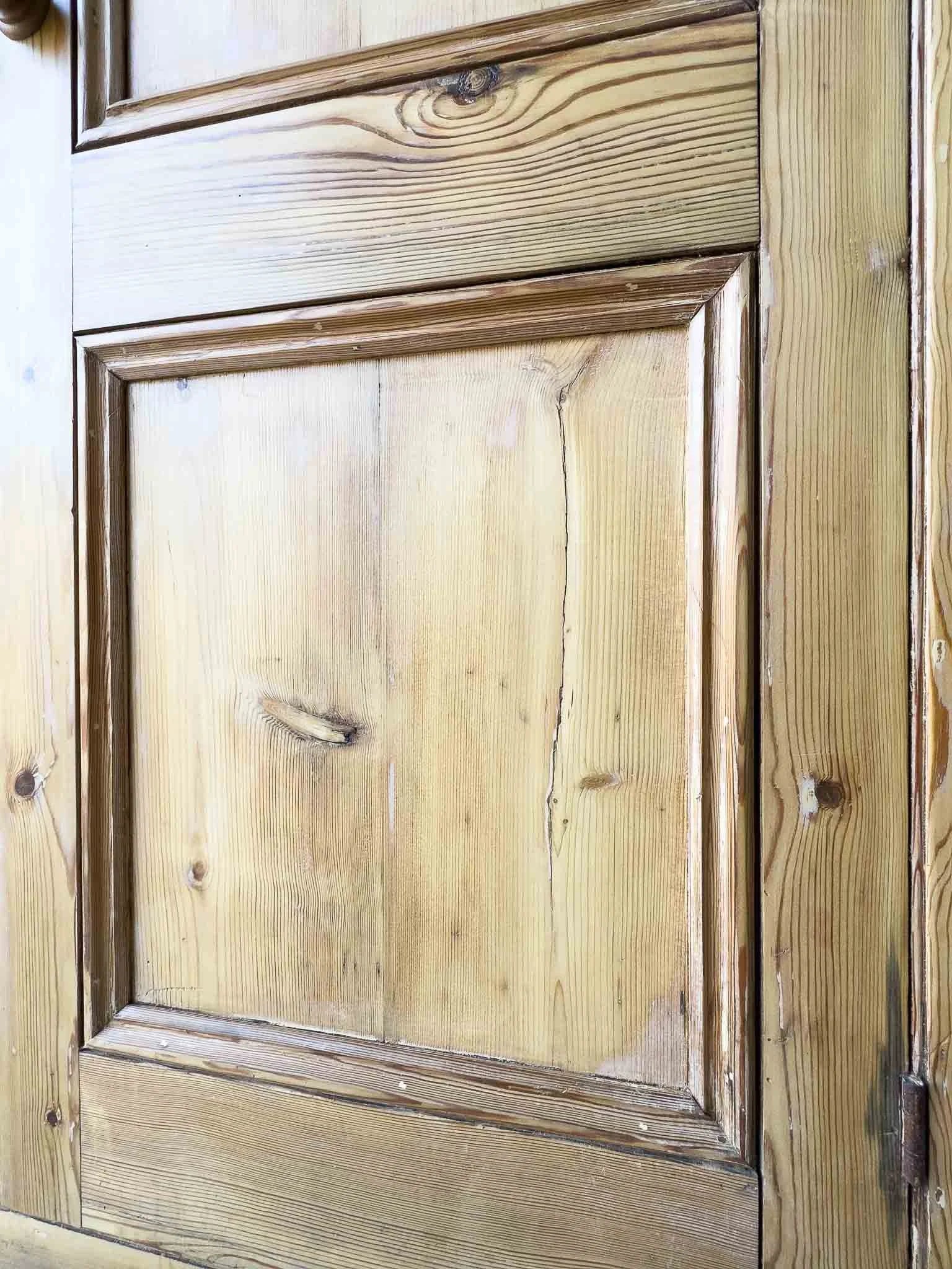 A large antique pine cupboard