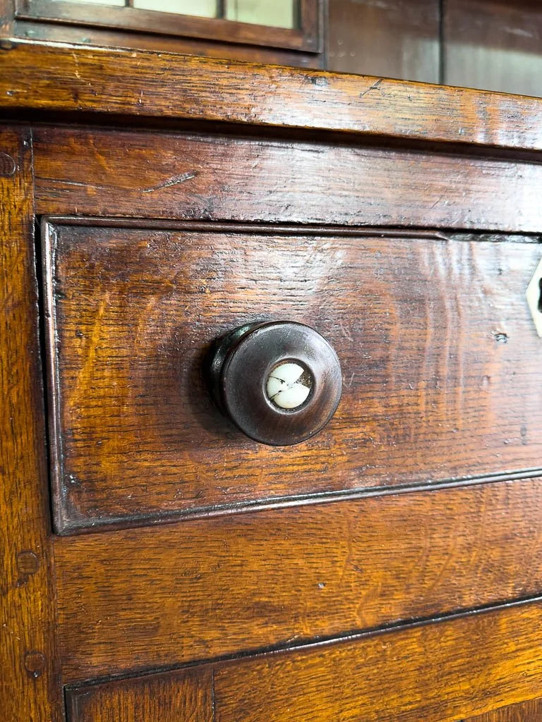 Antique English oak kitchen dresser with scalloped detail