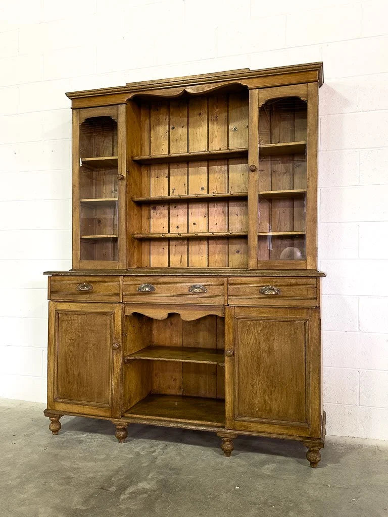 Antique European hutch with glass doors and a plate rack