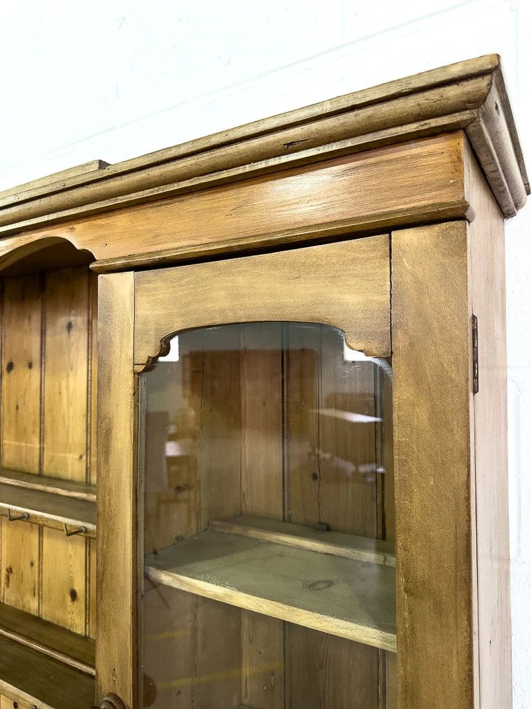 Antique European hutch with glass doors and a plate rack