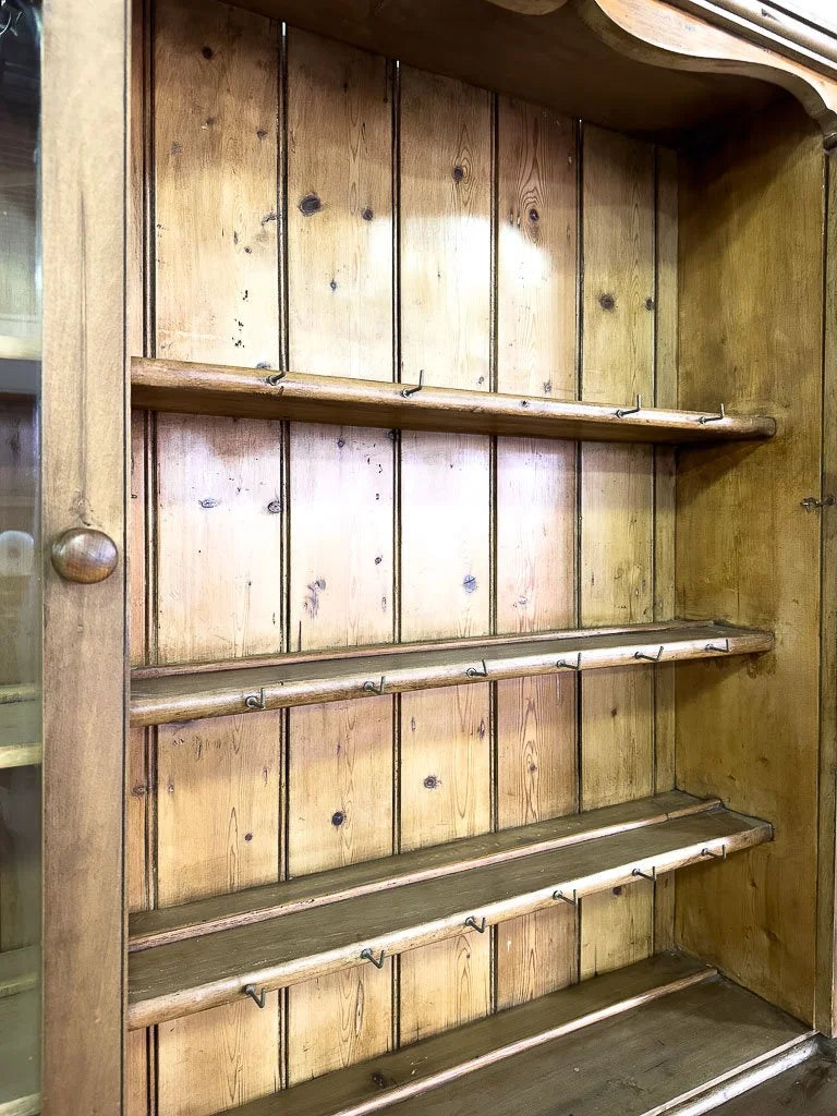 Antique European hutch with glass doors and a plate rack