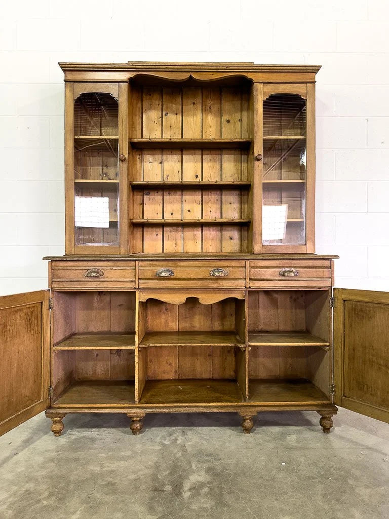 Antique European hutch with glass doors and a plate rack