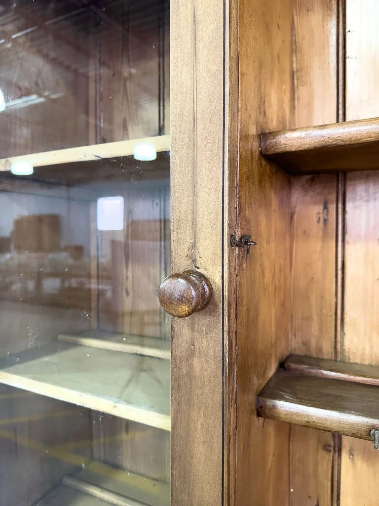 Antique European hutch with glass doors and a plate rack