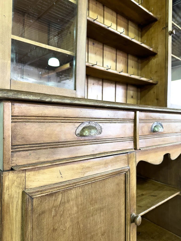 Antique European hutch with glass doors and a plate rack