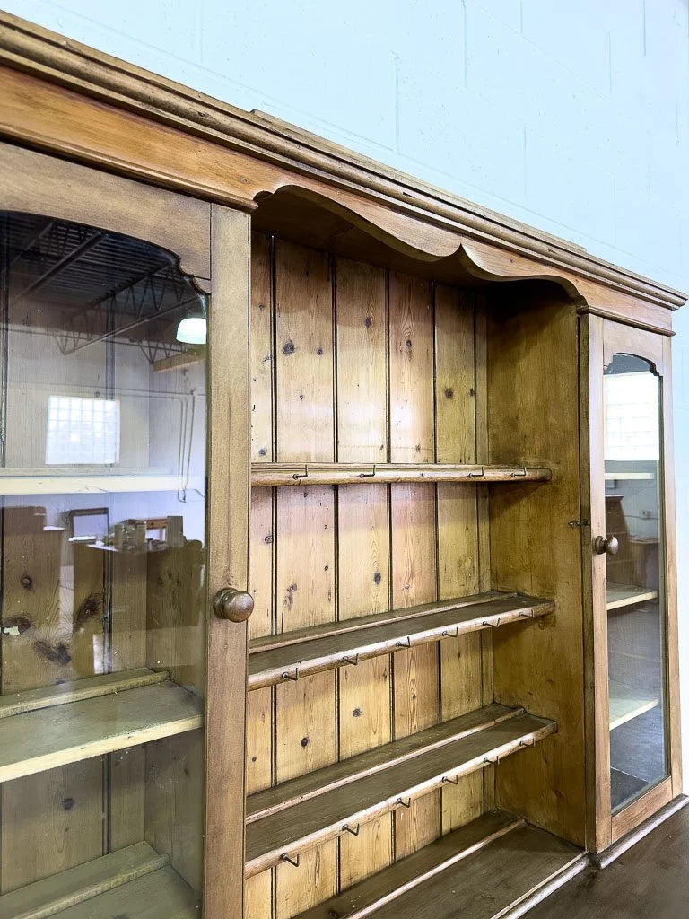 Antique European hutch with glass doors and a plate rack