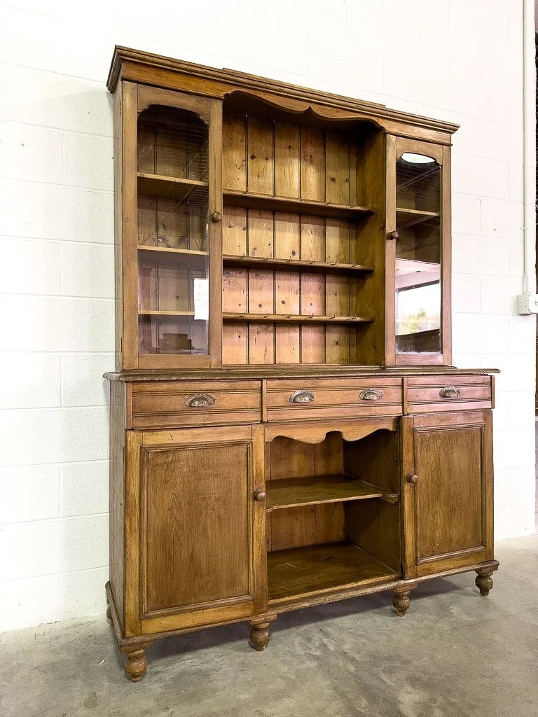 Antique European hutch with glass doors and a plate rack