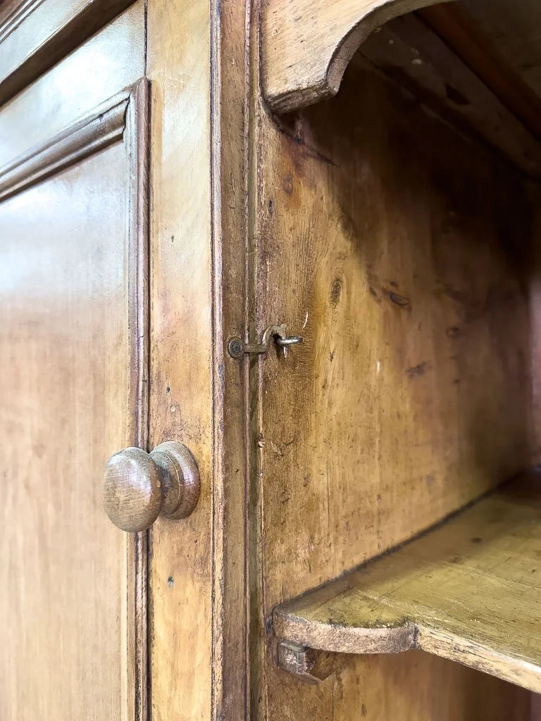 Antique European hutch with glass doors and a plate rack