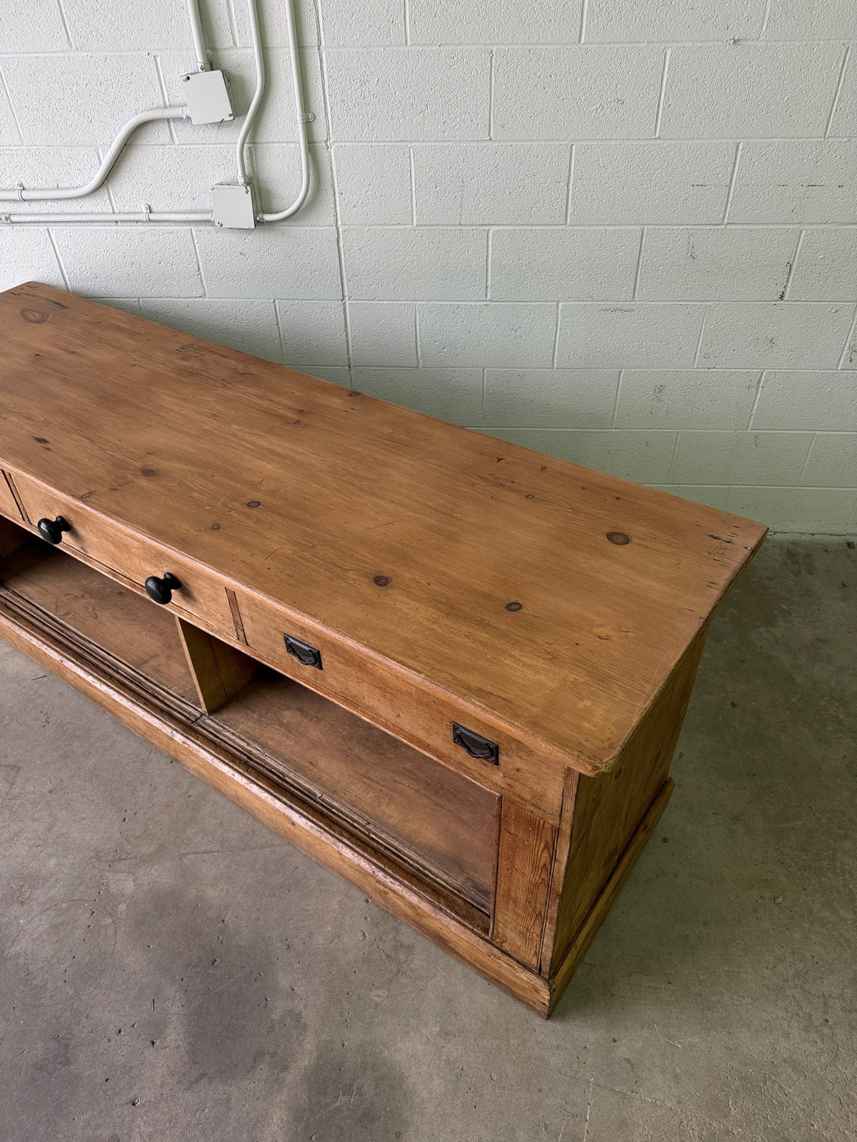 Antique English pine sideboard with open storage - House on Horizon