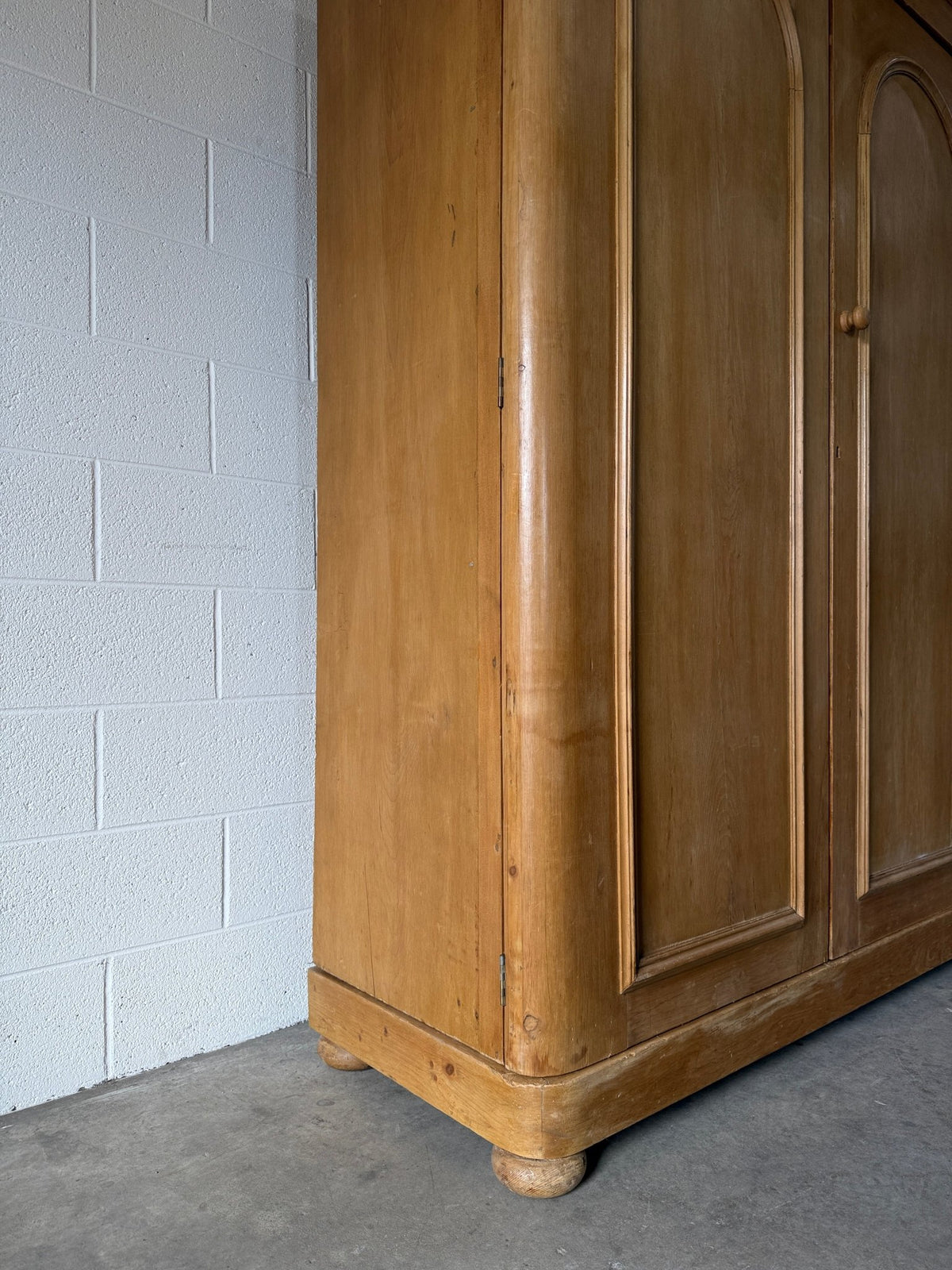 Antique English pine wardrobe with arched panel doors and fitted interior - House on Horizon