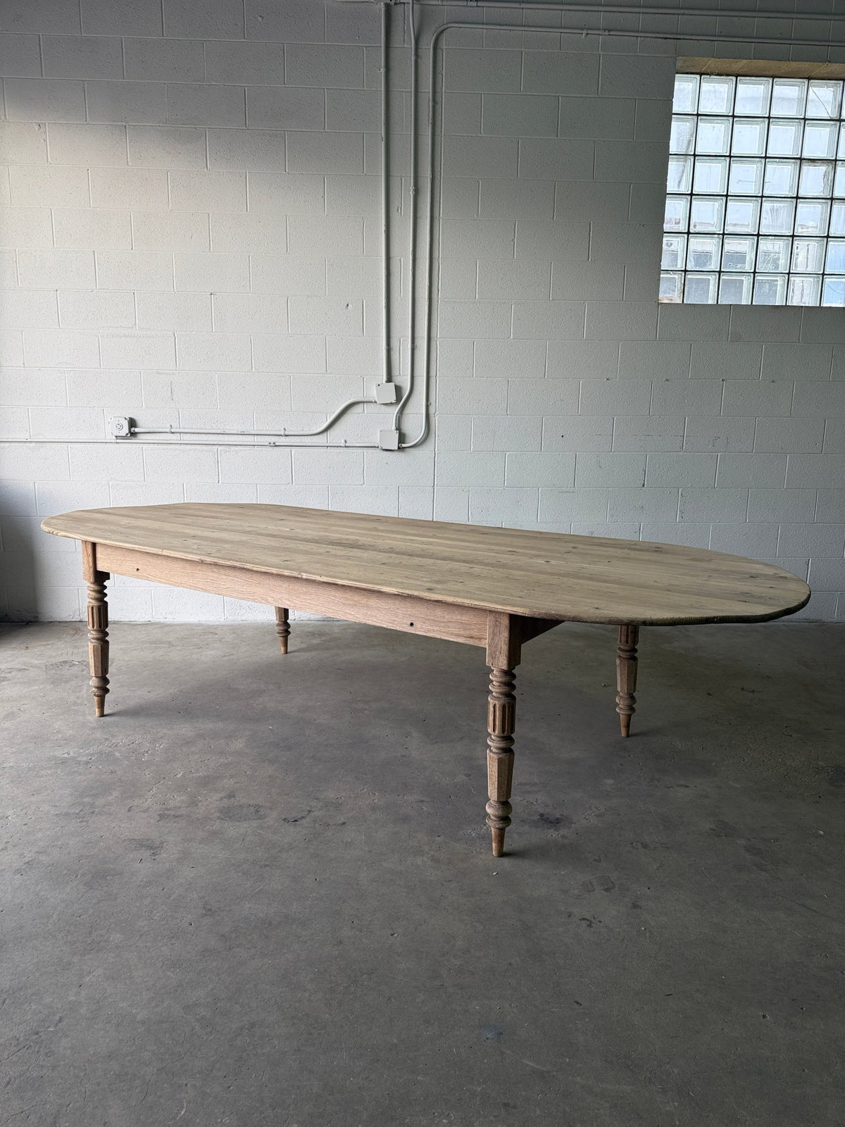 Gorgeous French pill-shaped dining table - House on Horizon