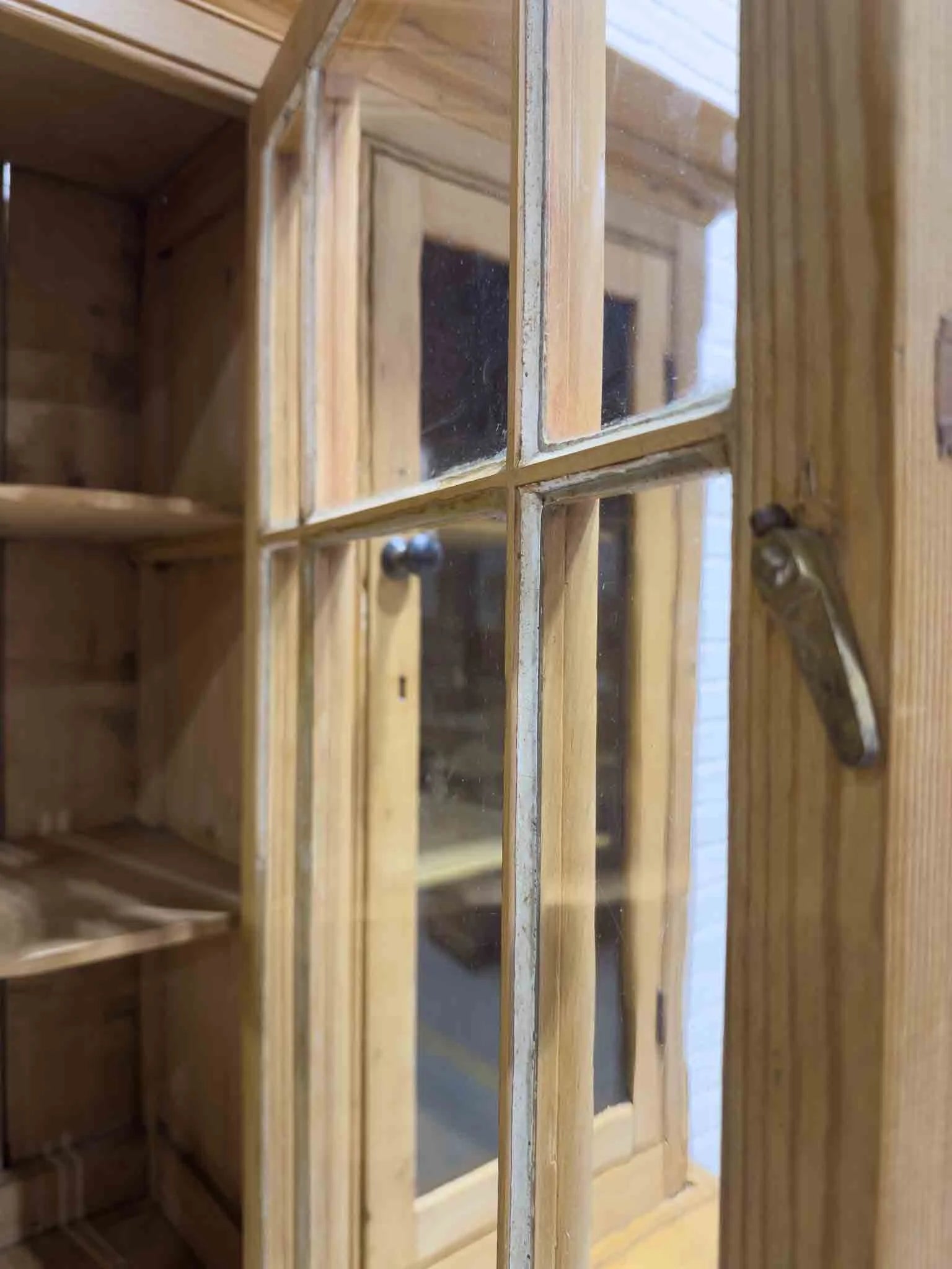 Antique English cupboard with glass doors