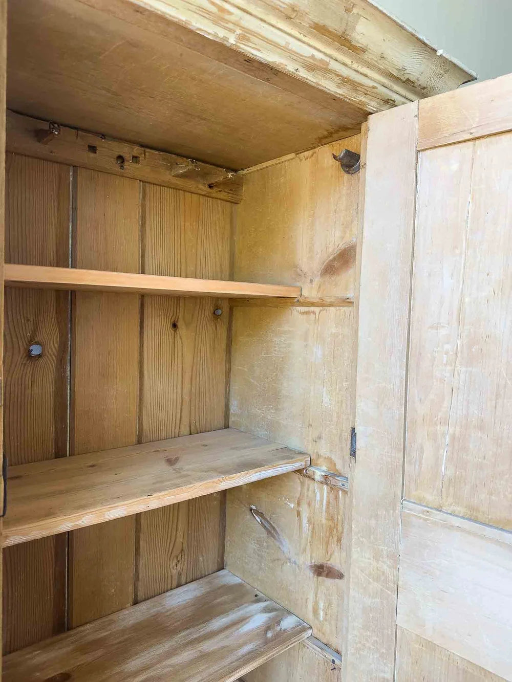Tall English antique pine cupboard