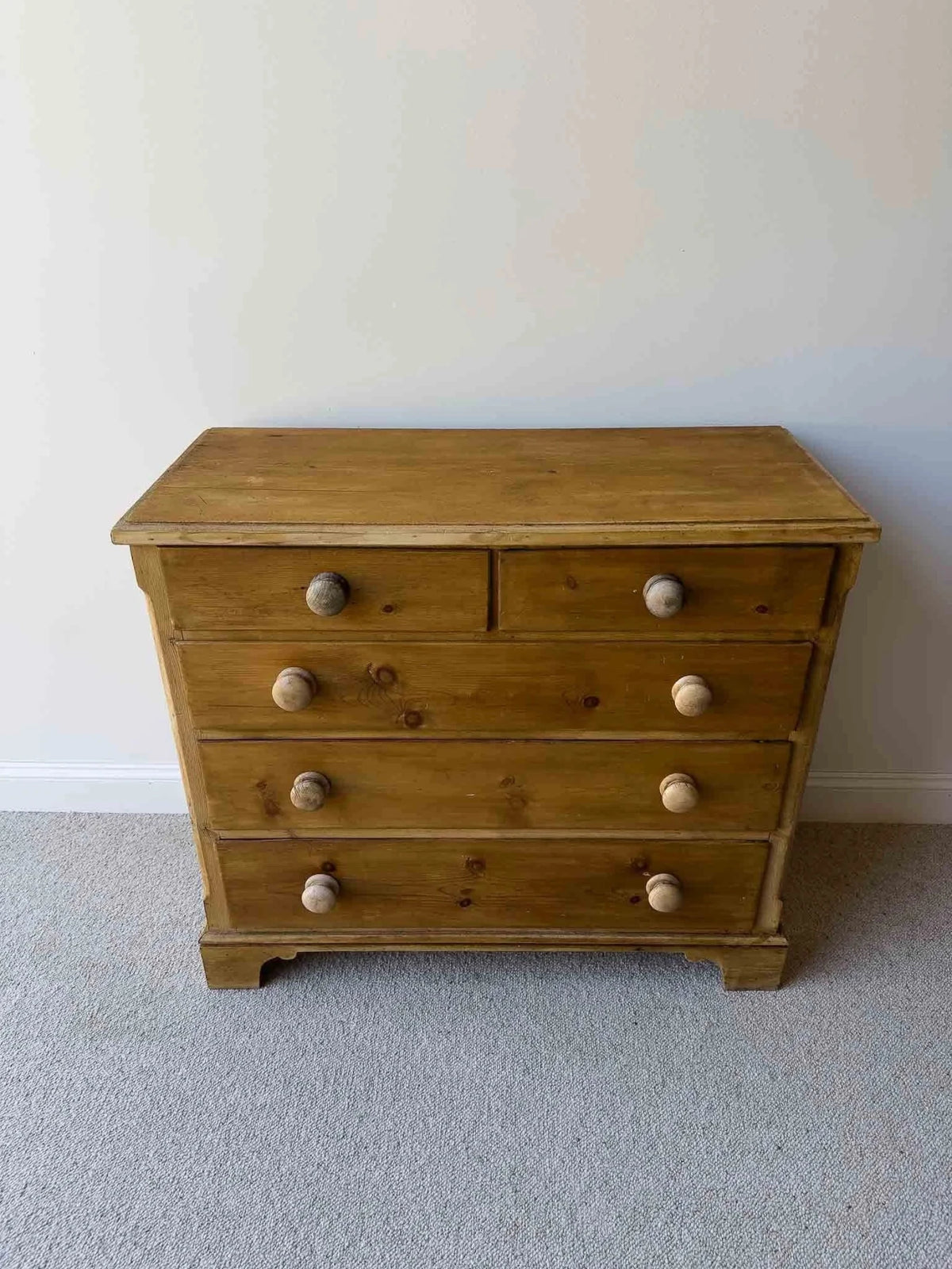 Mid-brown colored set of victorian pine drawers - House on Horizon