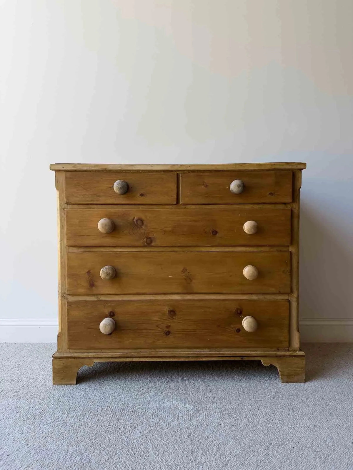 Mid-brown colored set of victorian pine drawers - House on Horizon