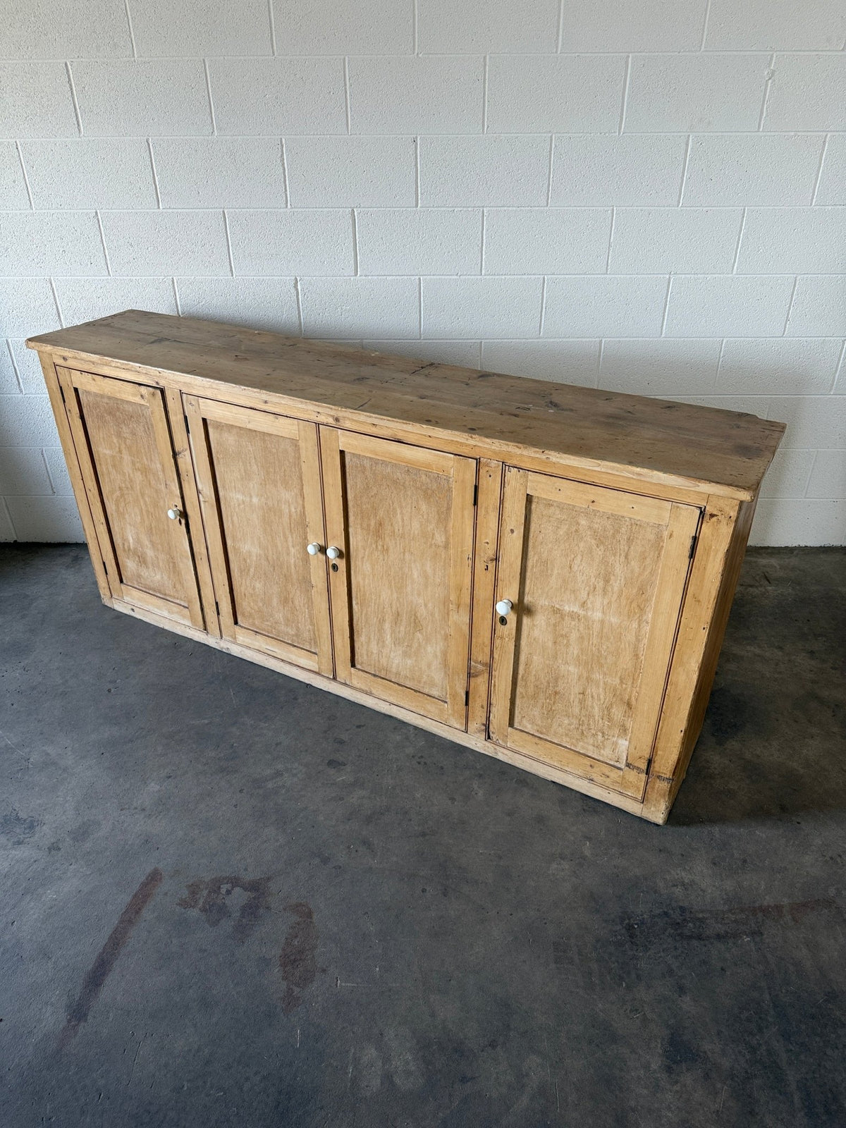 Simple antique pine sideboard with four doors - House on Horizon