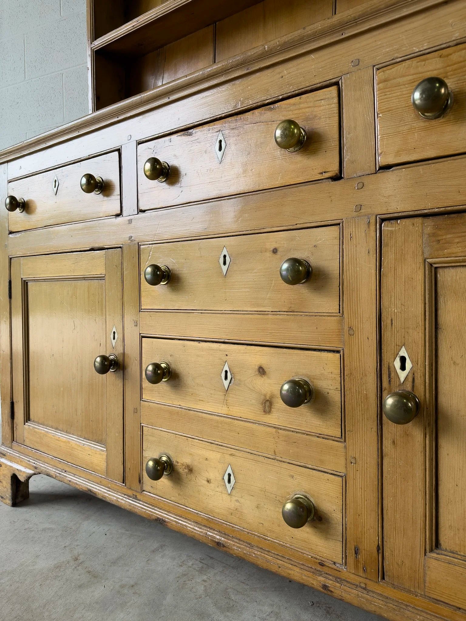 Antique English kitchen dresser with warm patina