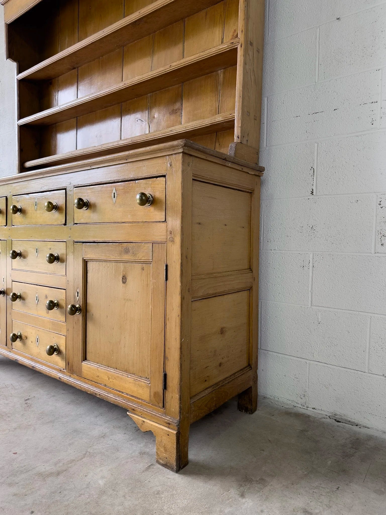 Antique English kitchen dresser with warm patina