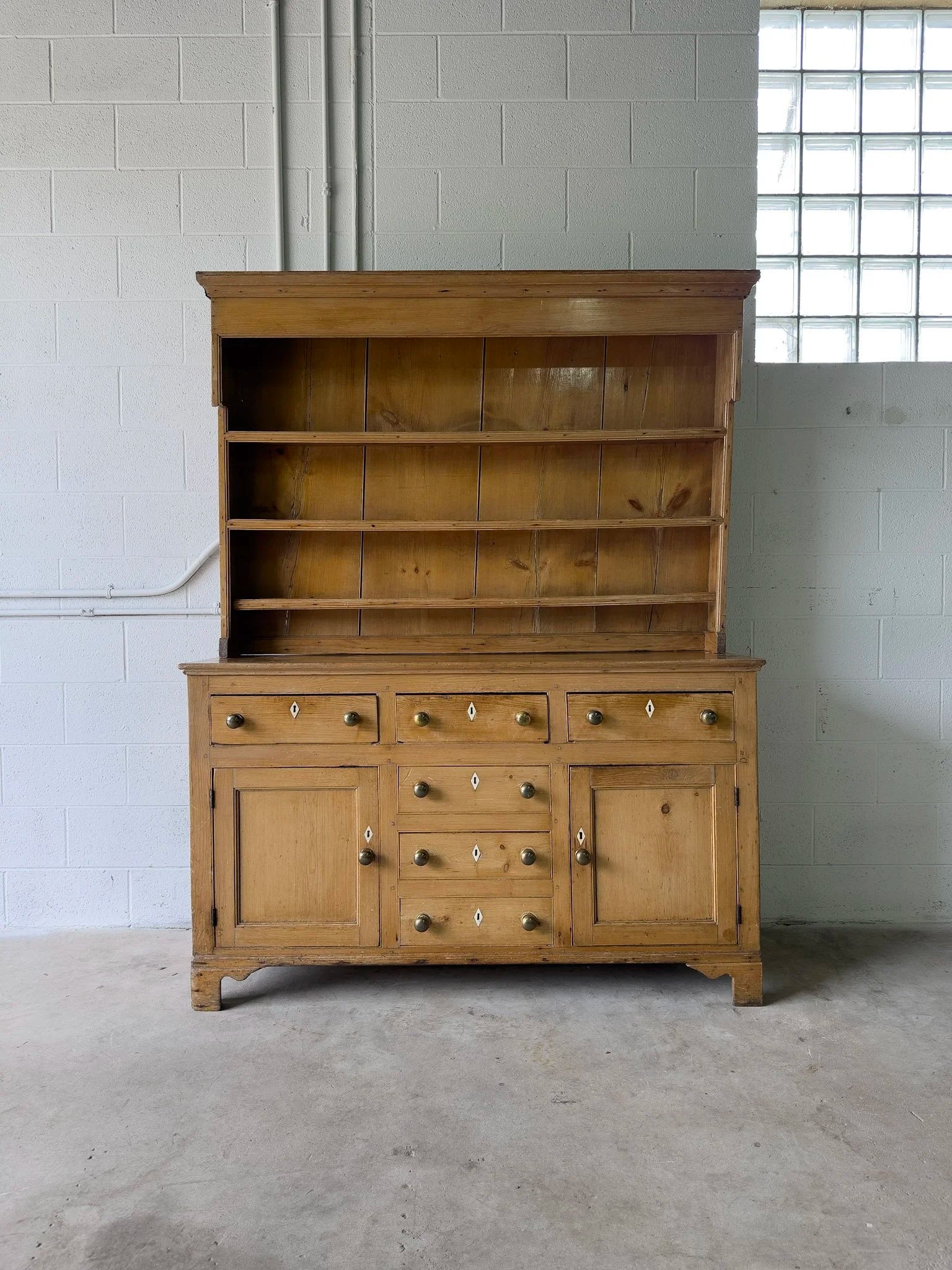 Antique English kitchen dresser with warm patina