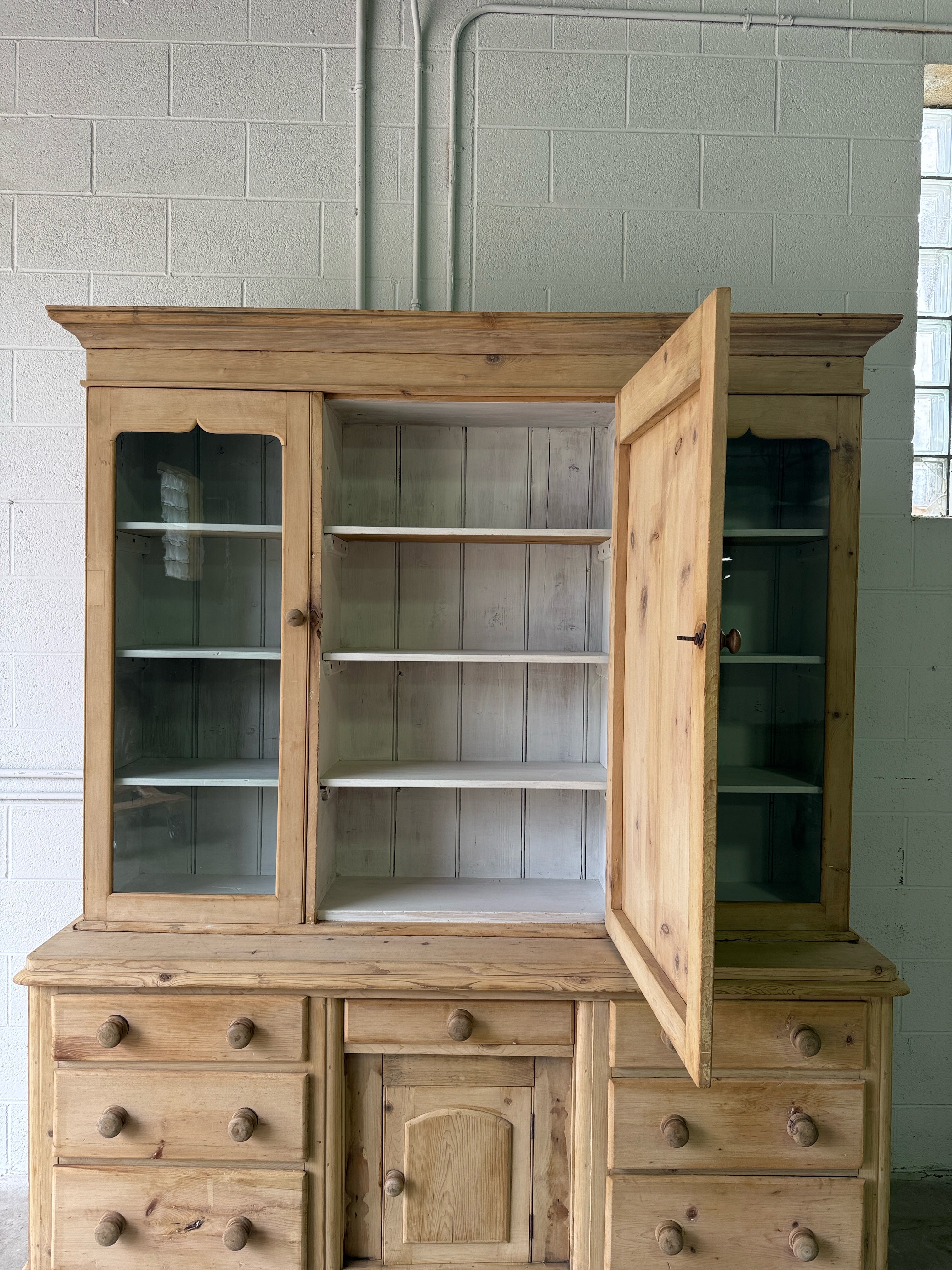 Antique pine housekeepers cupboard with wavy glass