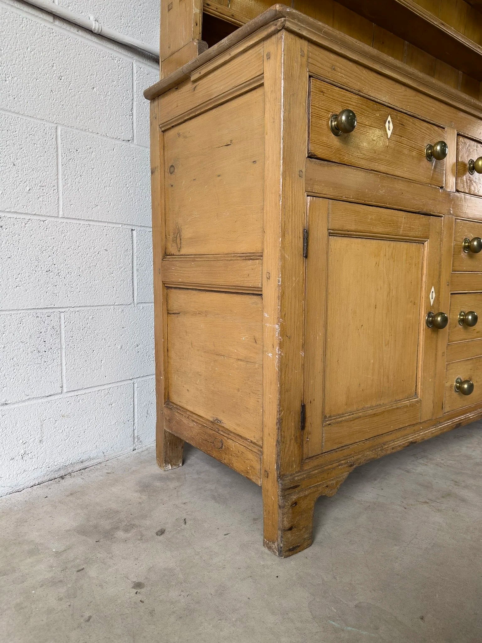 Antique English kitchen dresser with warm patina