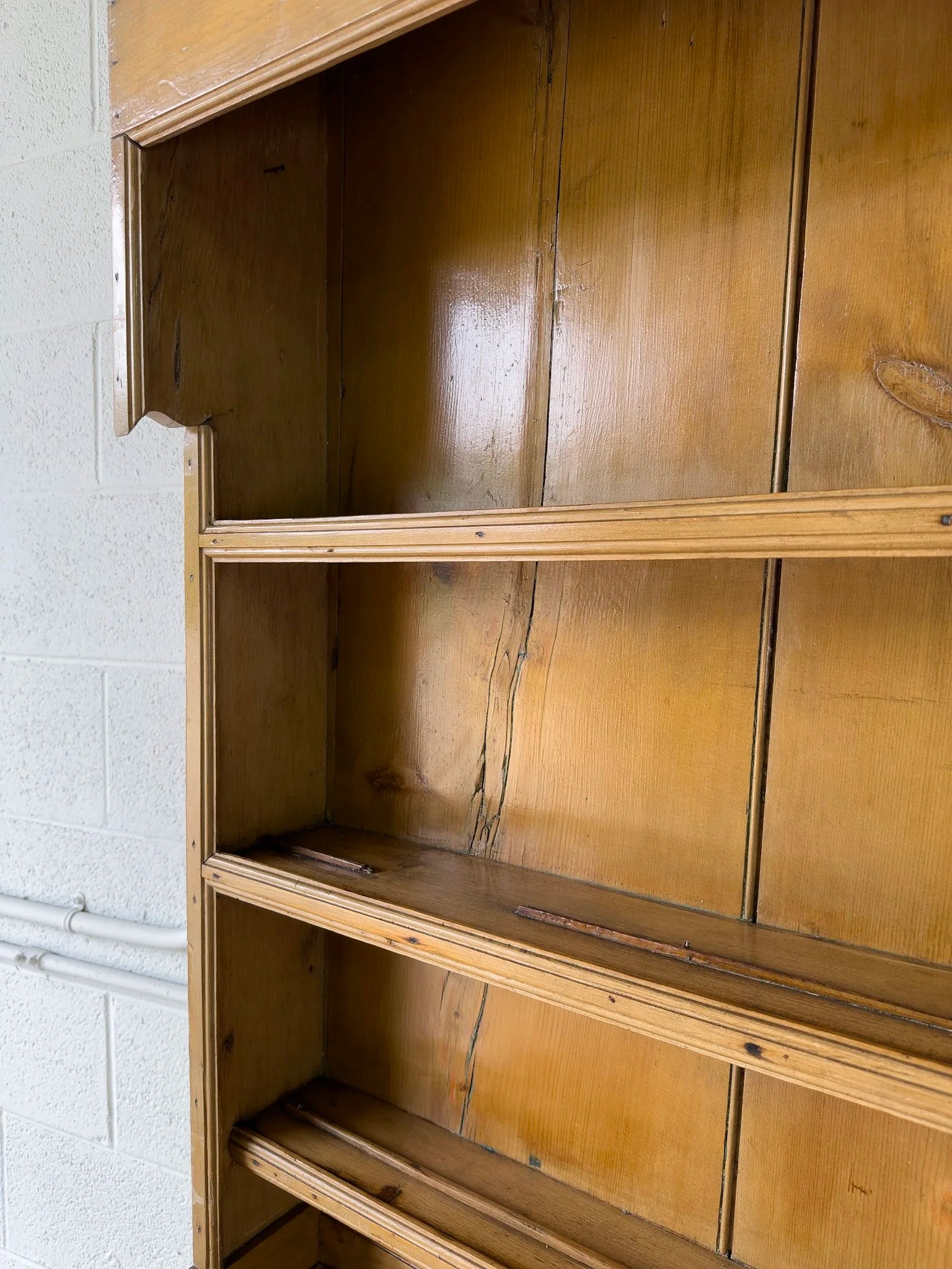Antique English kitchen dresser with warm patina