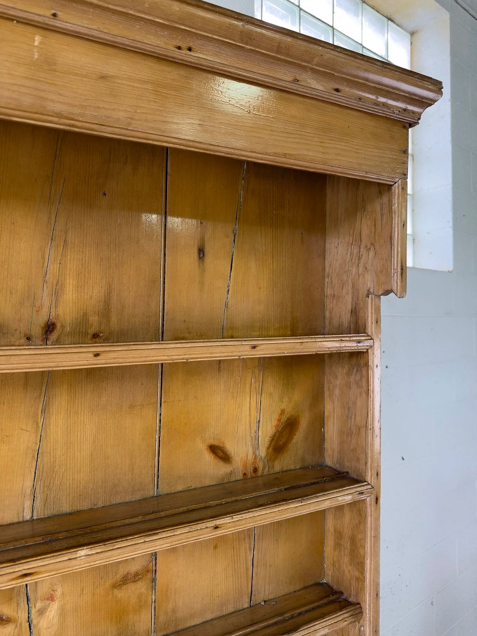 Antique English kitchen dresser with warm patina