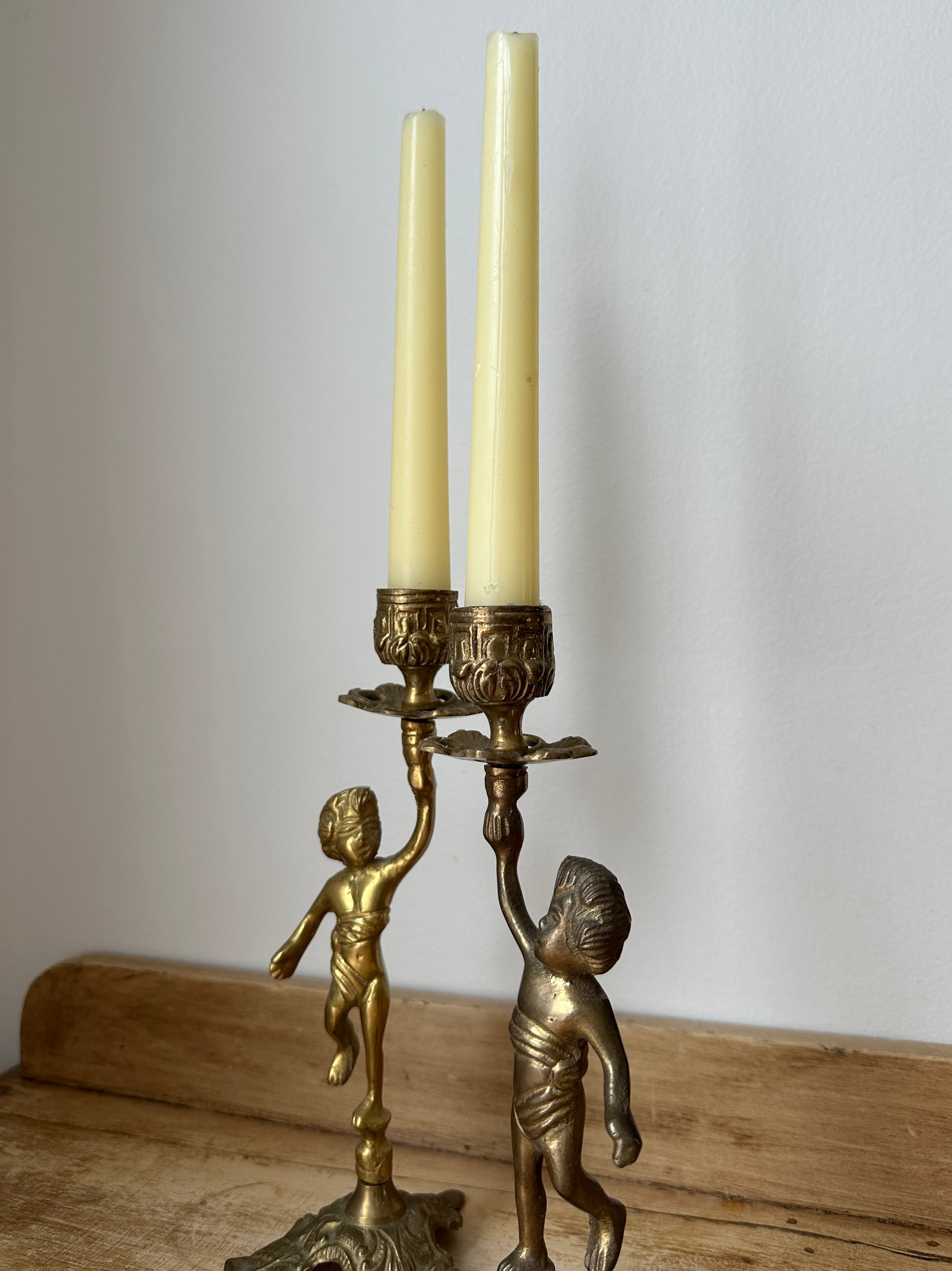 Brass cherub candlestick set