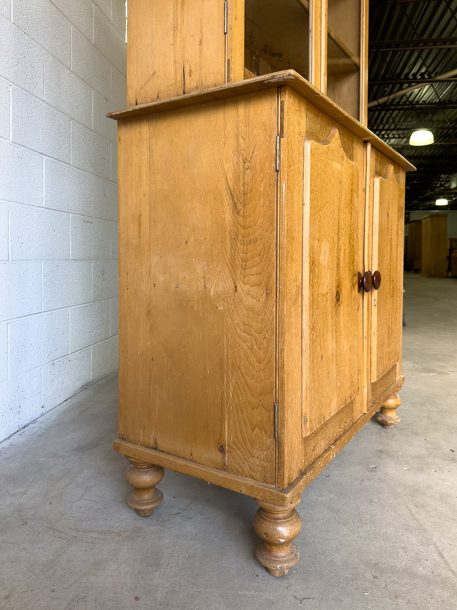 Antique English pine cupboard with wavy glass