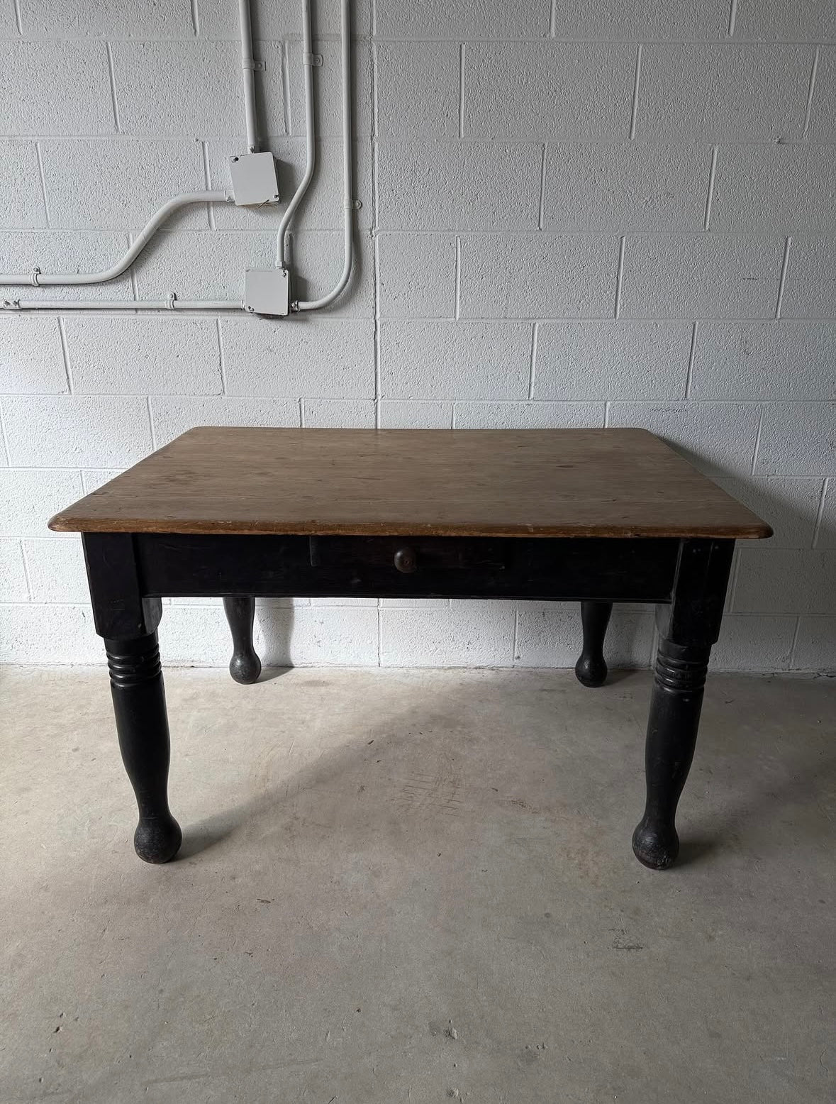 Antique black pine table with turned legs