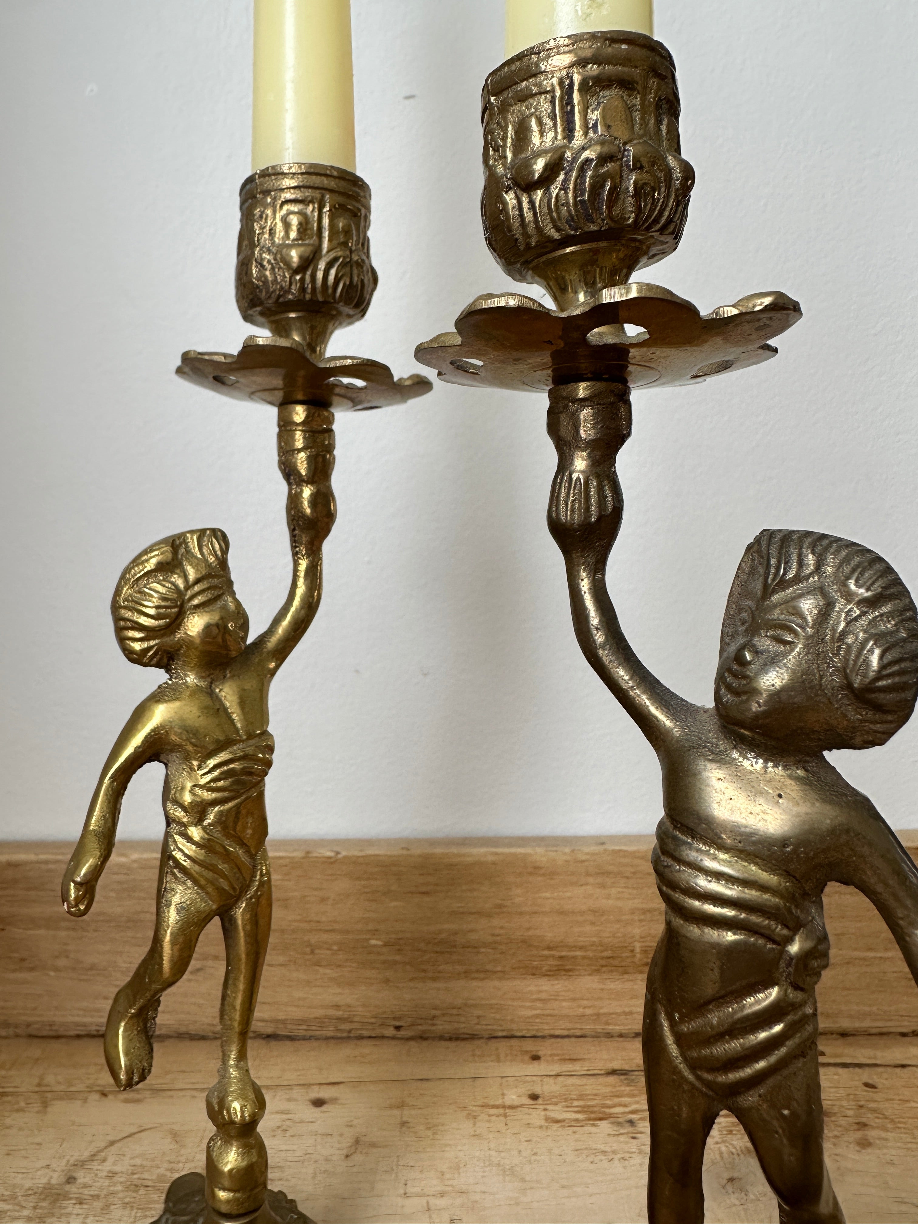 Brass cherub candlestick set