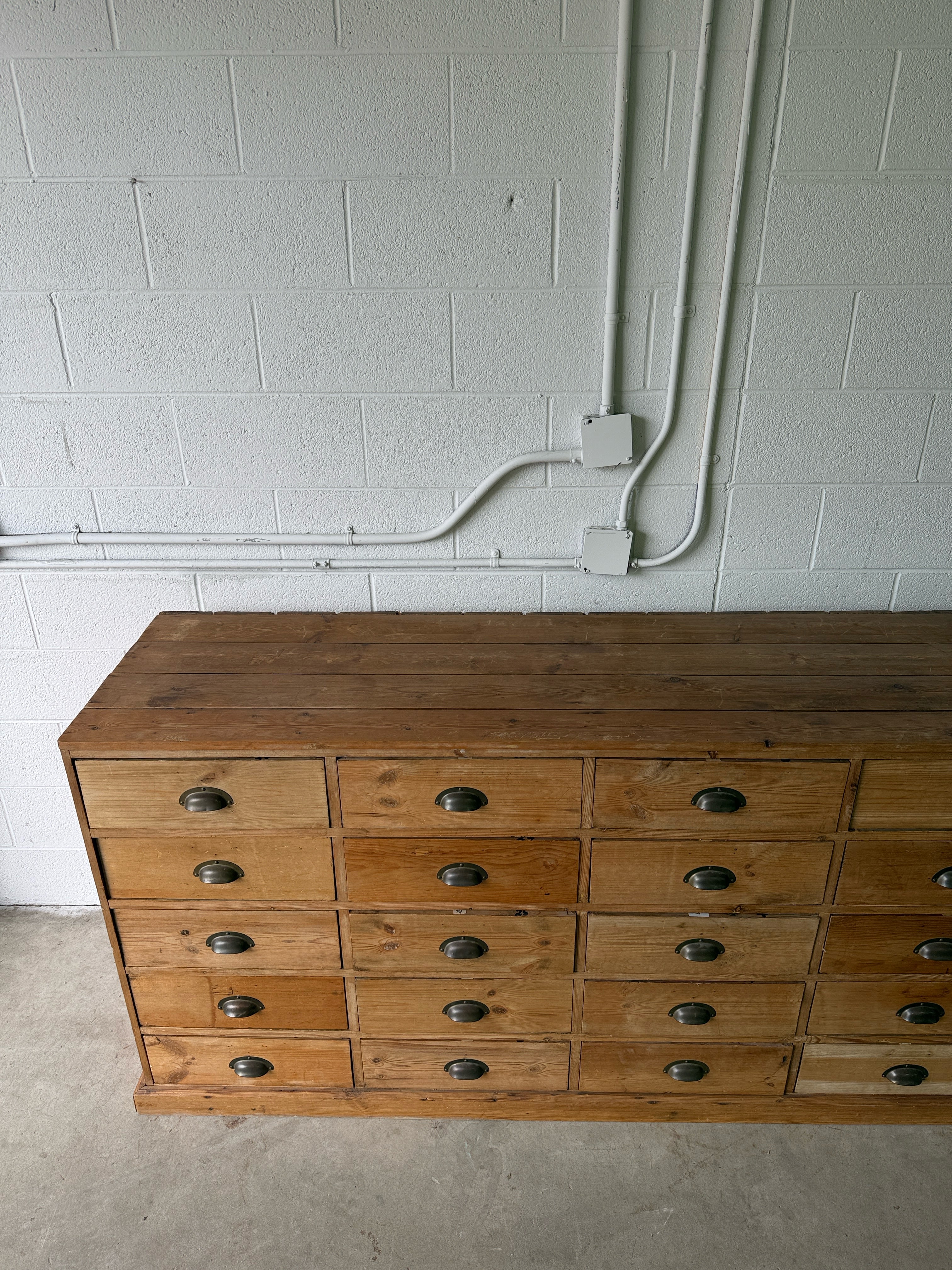 Antique European bank of haberdashery drawers