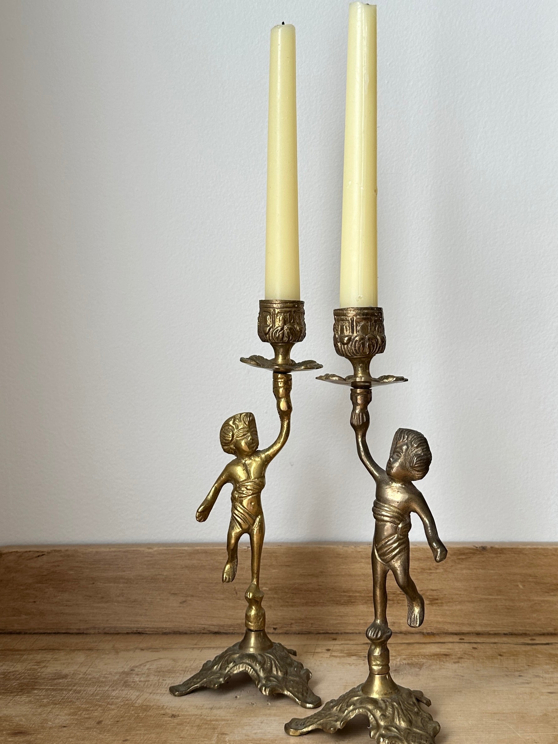 Brass cherub candlestick set