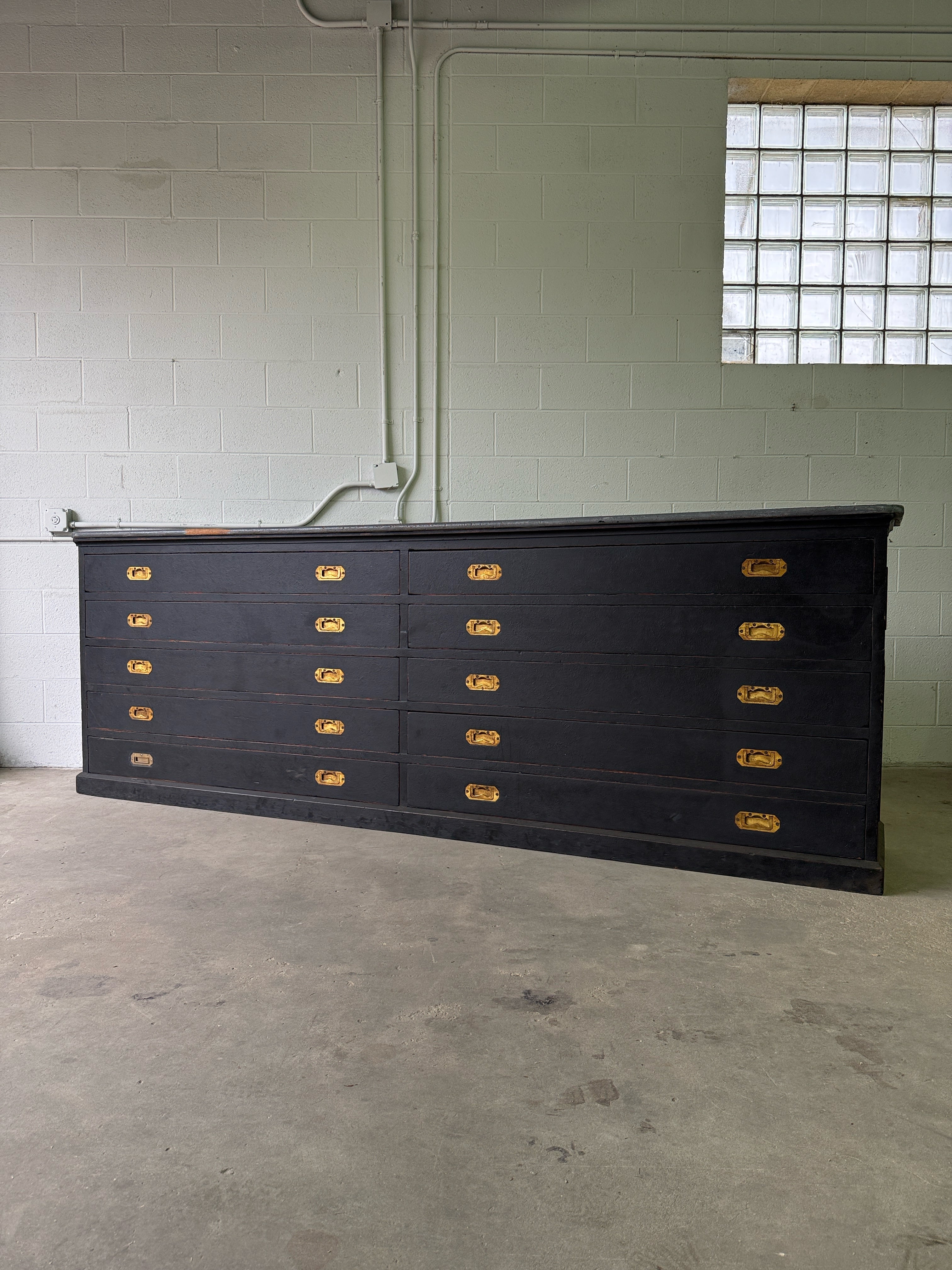 Monumental antique bank of 10 drawers with brass campaign handles