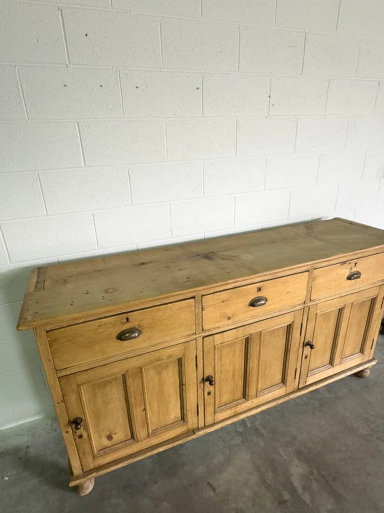 Tall antique English pine sideboard with drawers