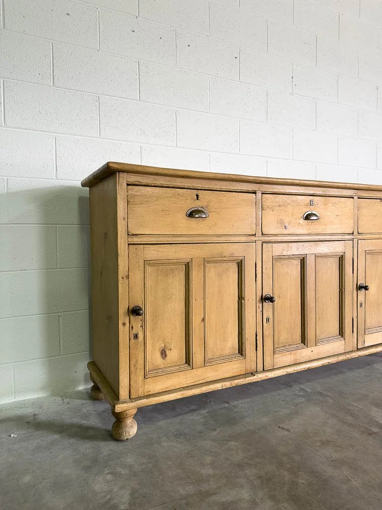 Tall antique English pine sideboard with drawers