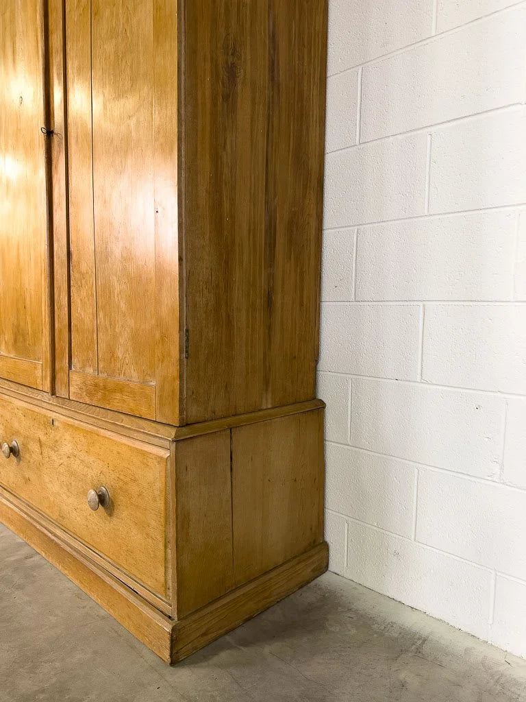 Antique English pine wardrobe or cupboard with a drawer